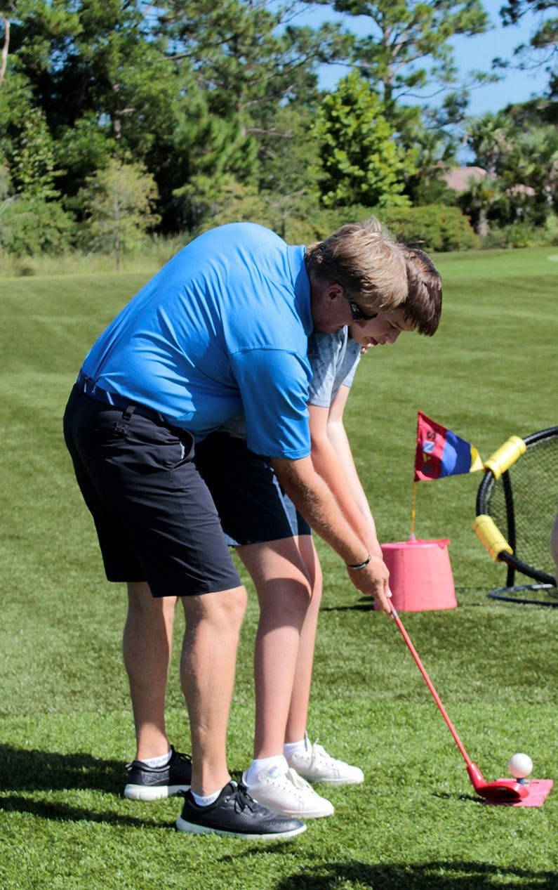 Ernie Els Teaching A Child Background