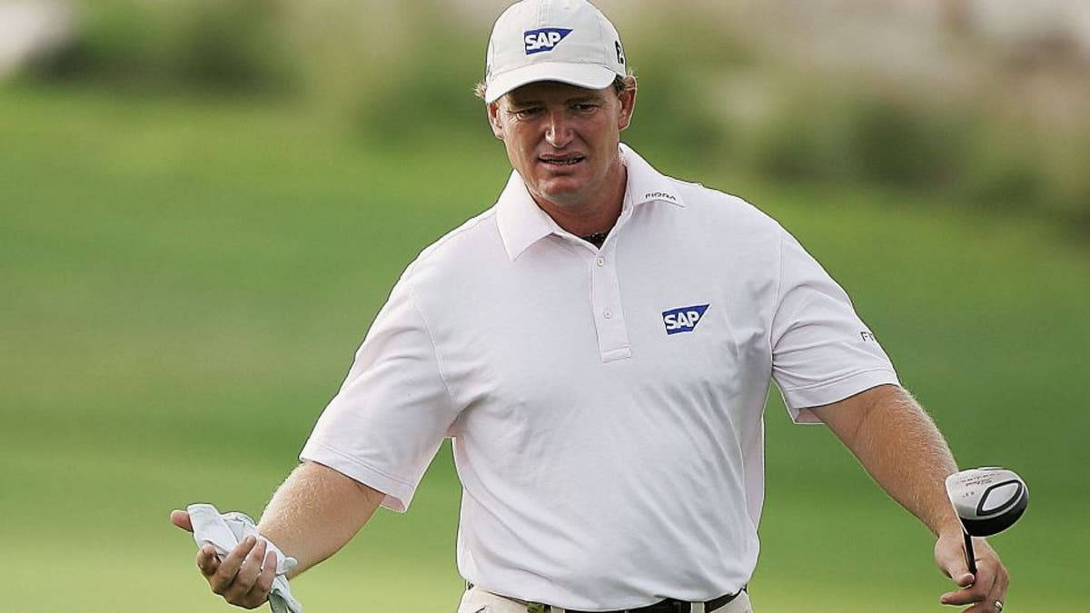 Ernie Els With A Golf Club Background