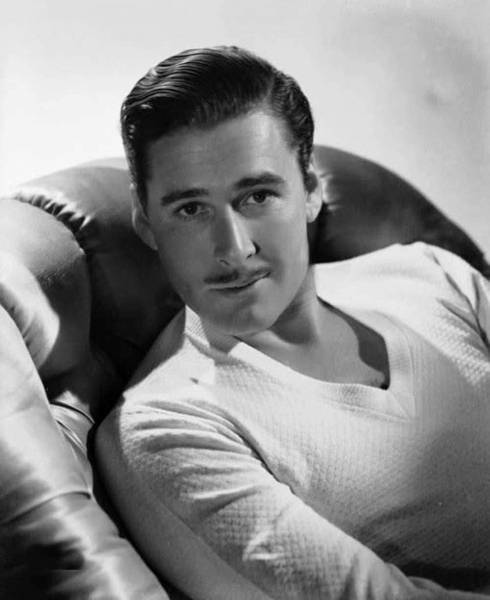 Errol Flynn Black And White Sitting Chair Background