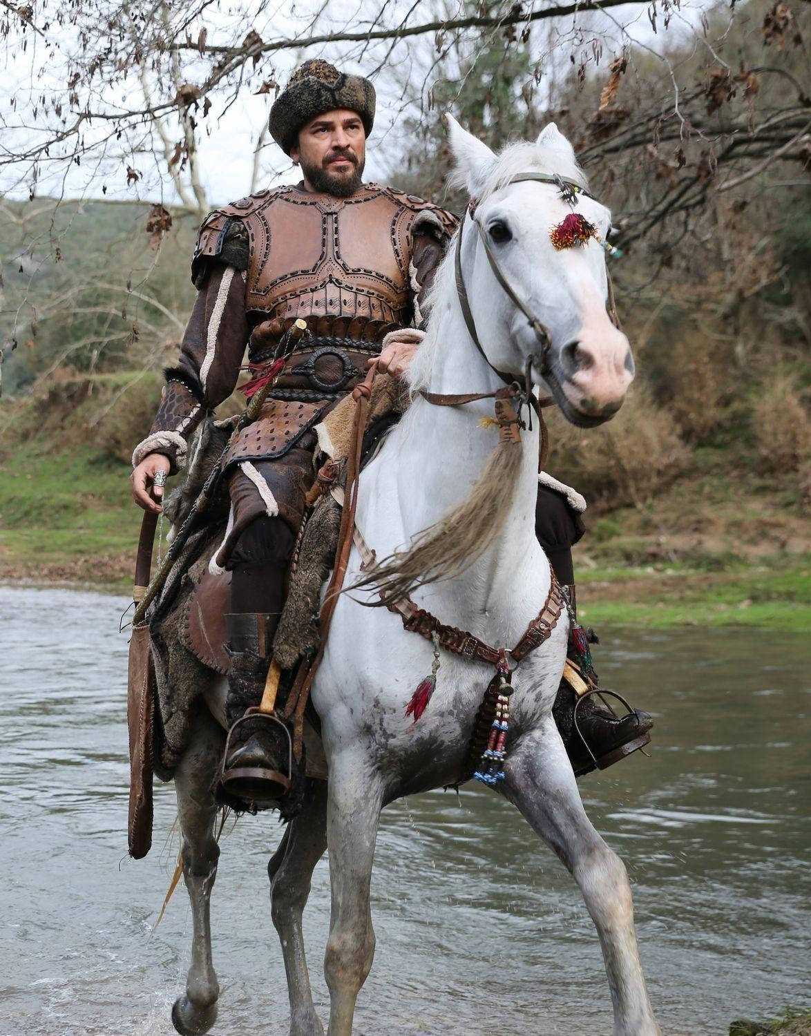Ertugrul Gazi Riding Horse On River Background