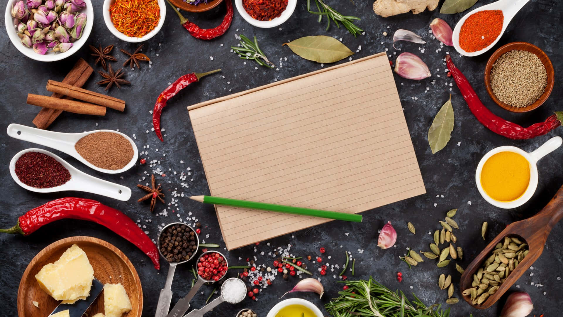 Essential Cooking Spices With Pen And Paper On Table Background