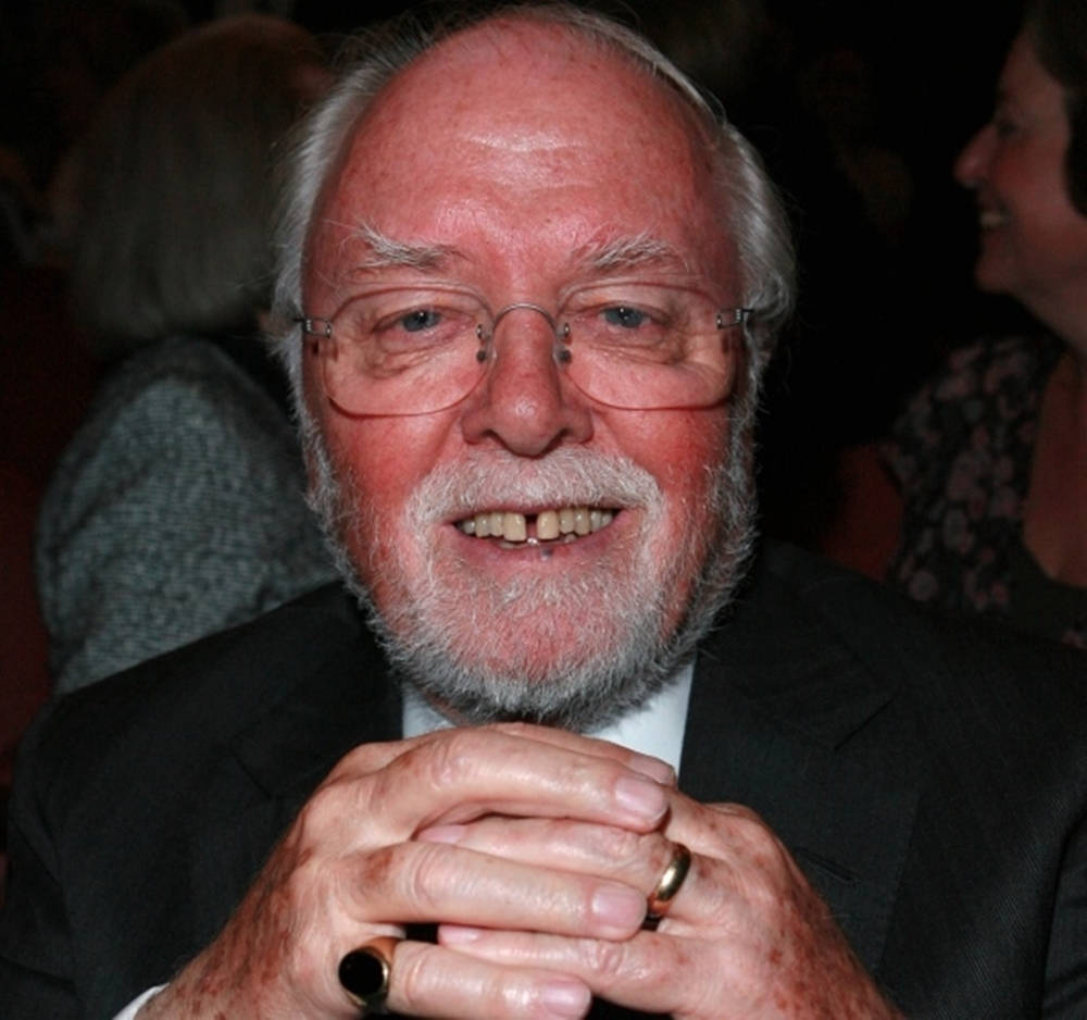 Esteemed Director Richard Attenborough With Ring Background