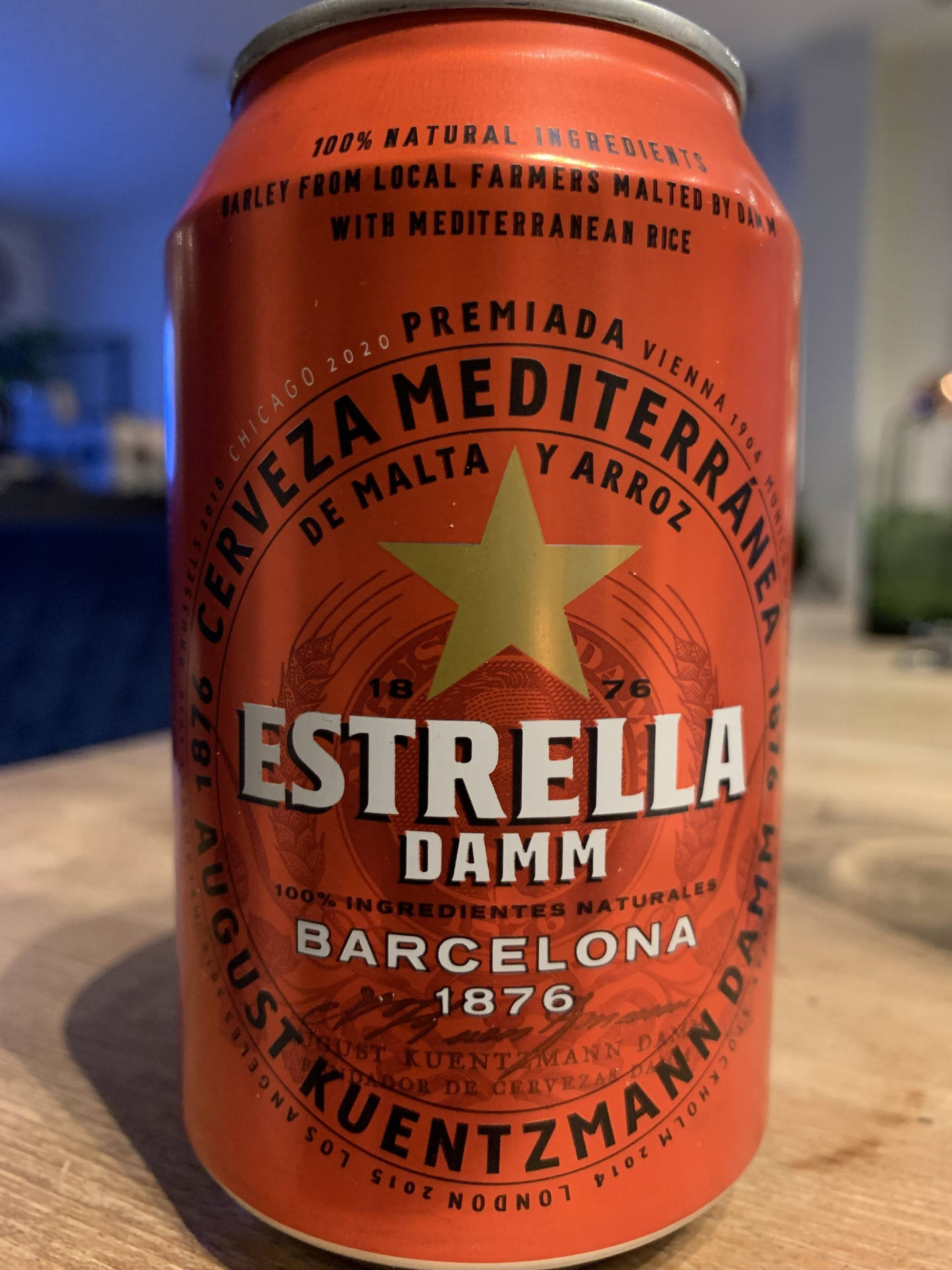 Estrella Damm In A Scarlet Red Can Background