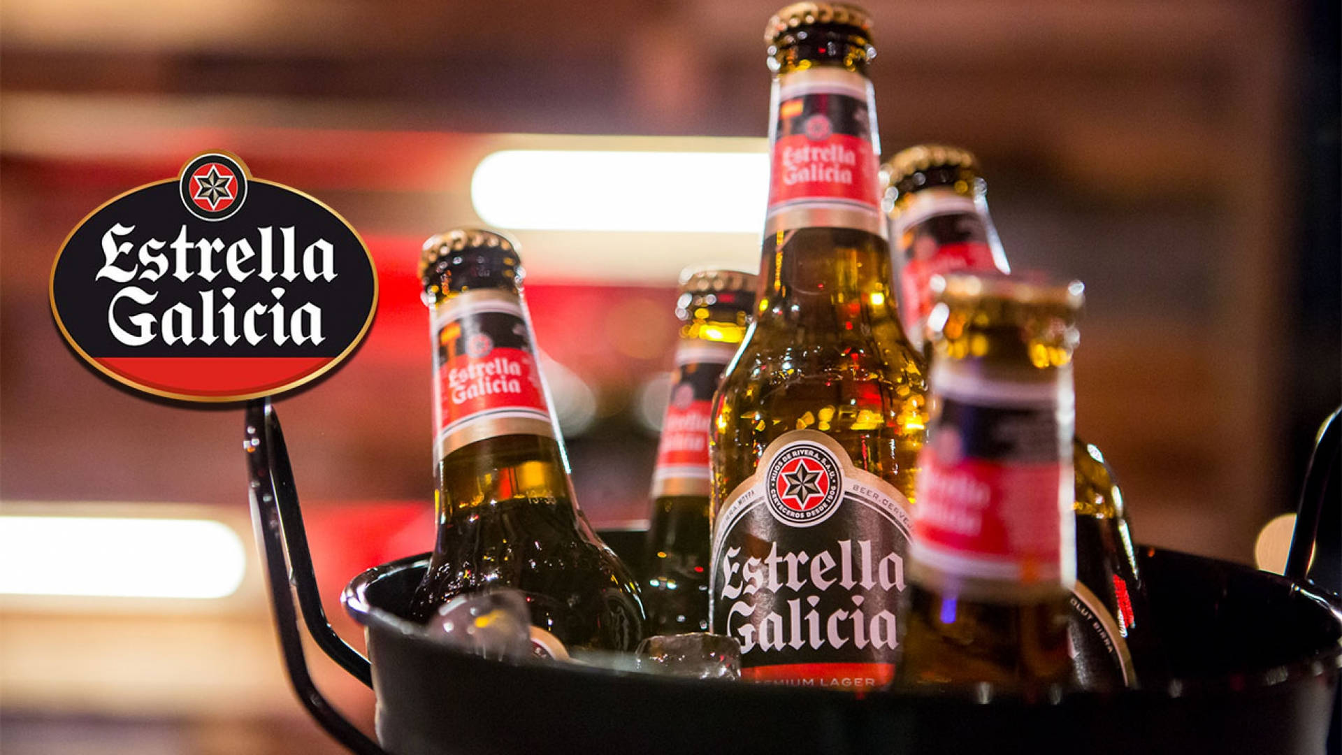 Estrella Galicia Special Beer Chilling In Cooler Bucket Background