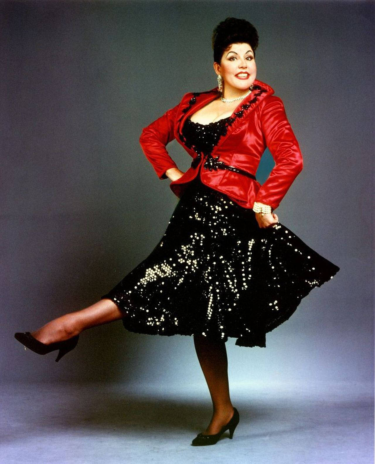 Ethel Merman Dancing In A Black And Red Outfit Background