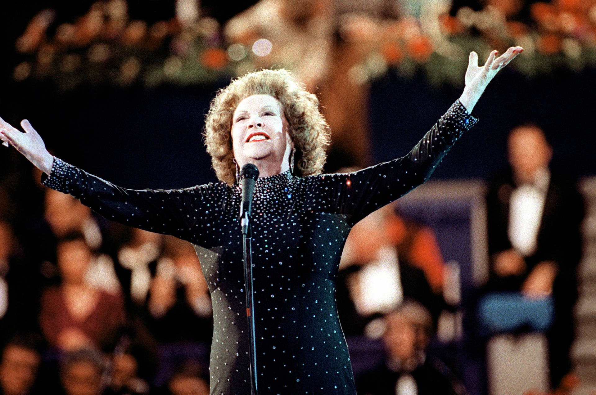 Ethel Merman Singing On Stage In Black Background