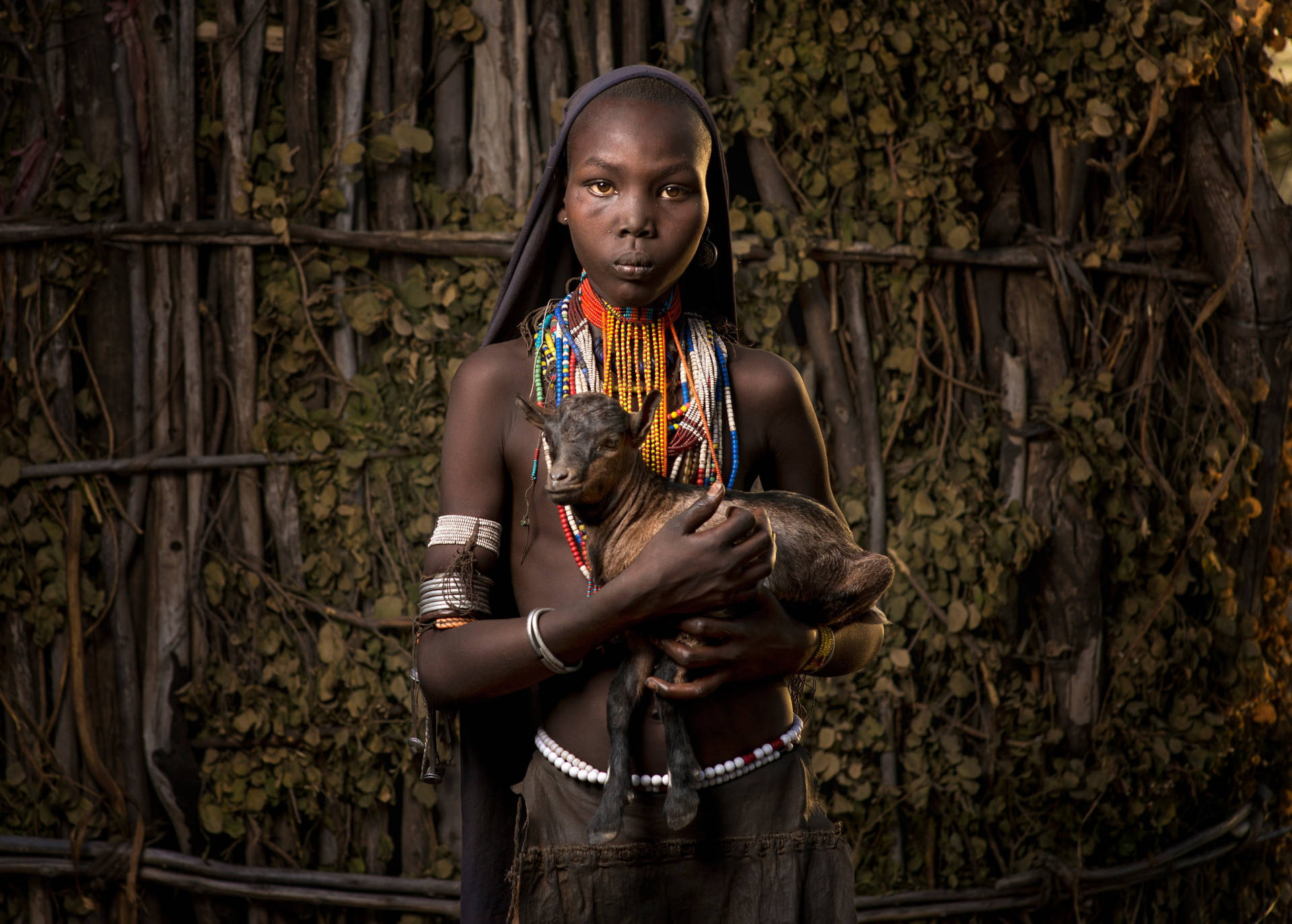 Ethiopia Girl Holding Goat Background