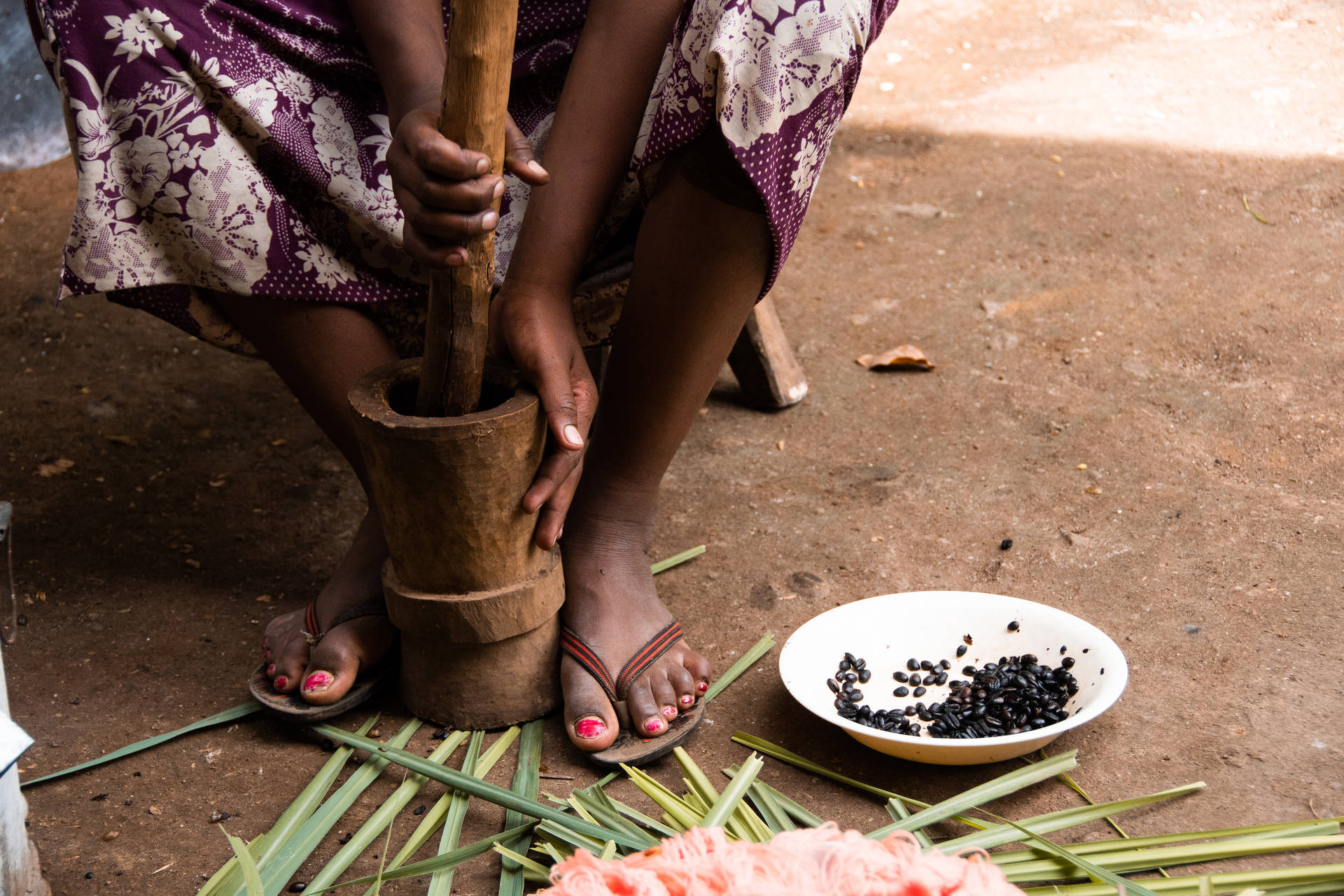 Ethiopia Woman Grinding Coffee Background