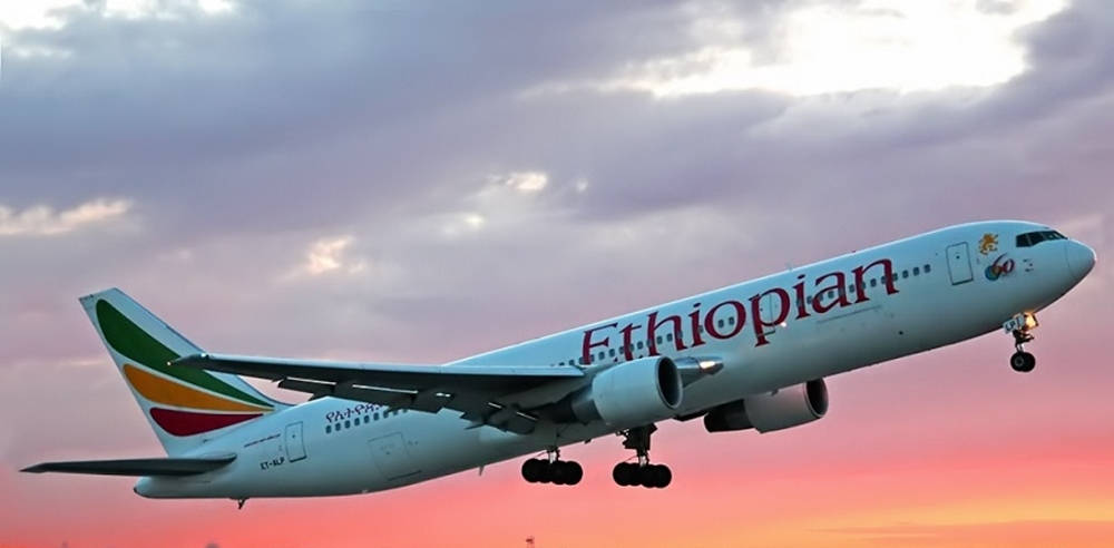 Ethiopian Airlines Plane Flying In Sunset Sky