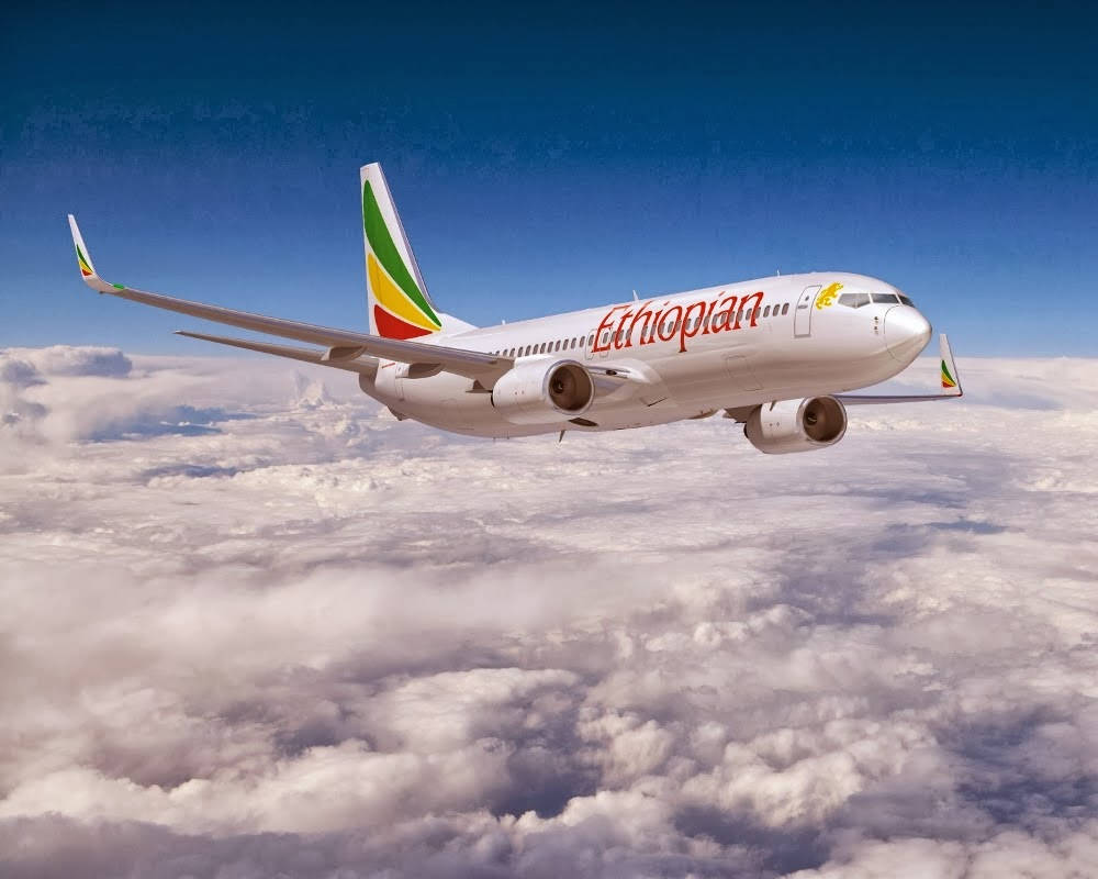 Ethiopian Airlines Plane Winging In Cloudy Sky Background