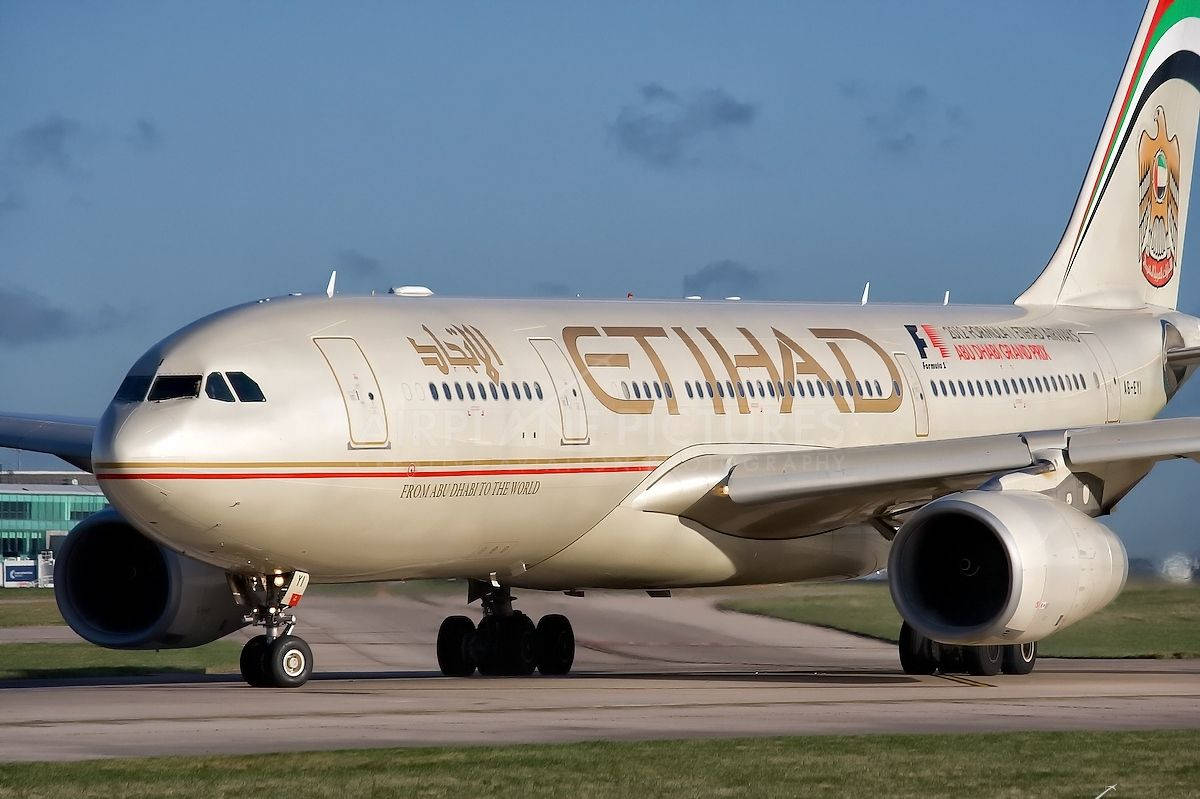 Etihad Airplane On Airport Runway Background