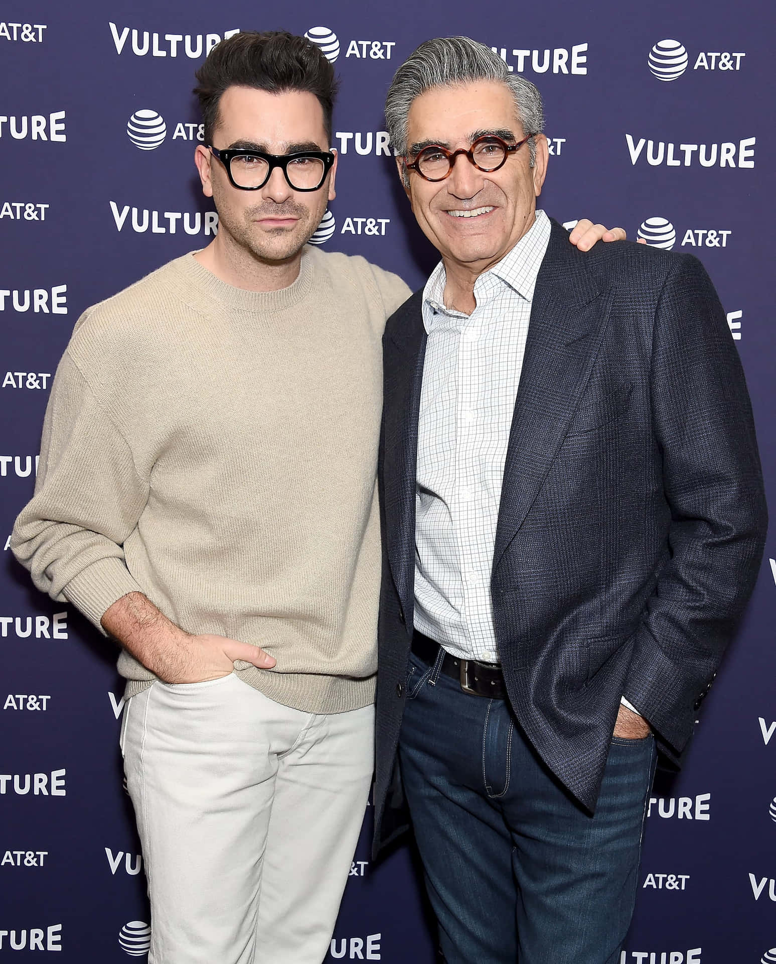Eugene Levy Giving A Candid Pose In A Blue Suit. Background