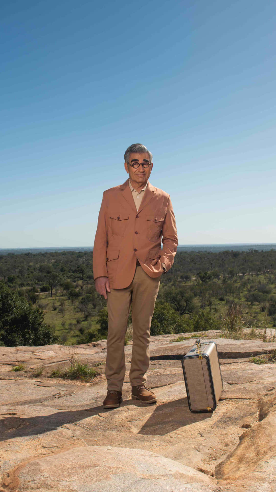 Eugene Levy In Thoughtful Stance Background