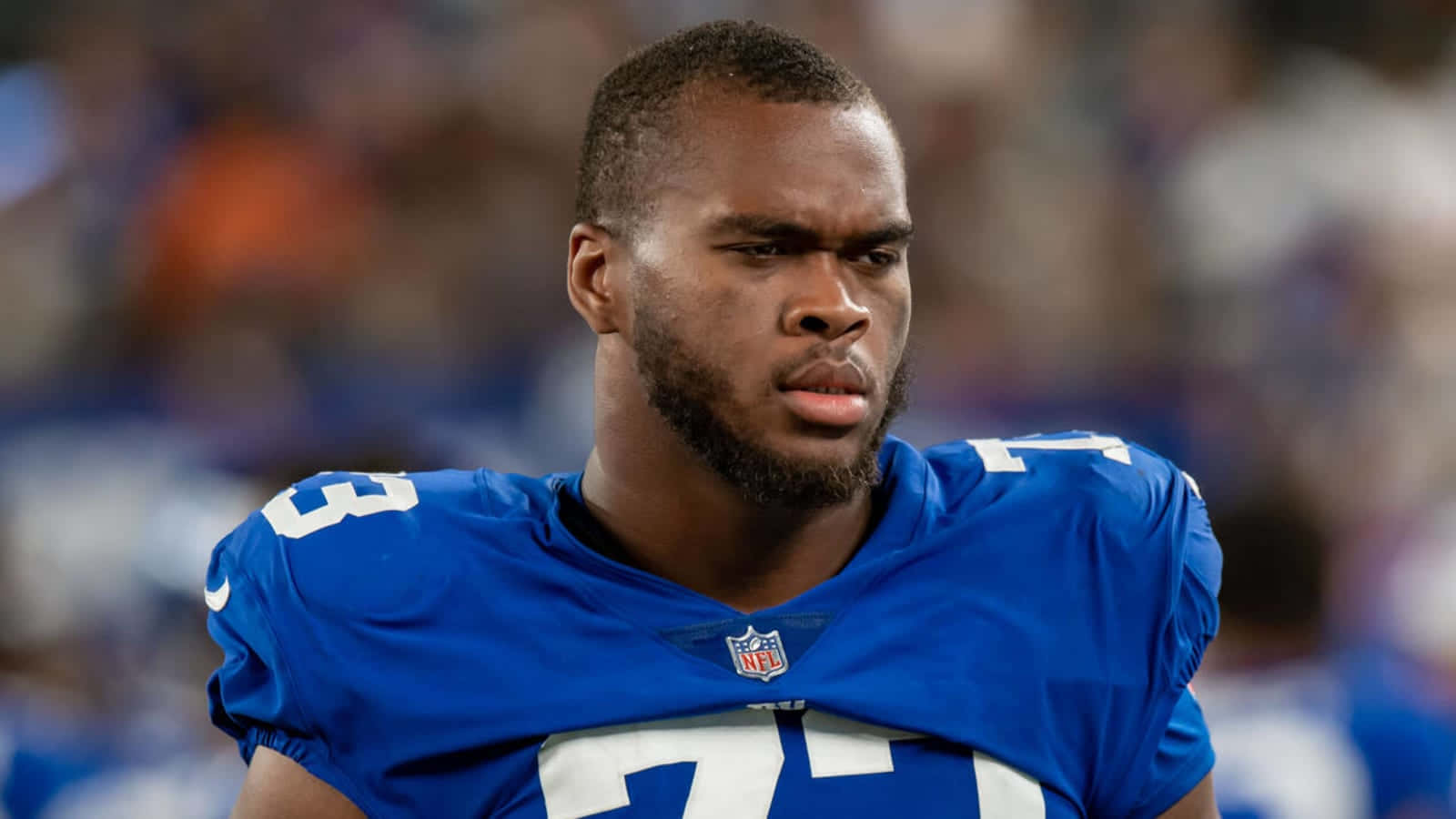 Evan Neal Serious Face Closeup Shot Background