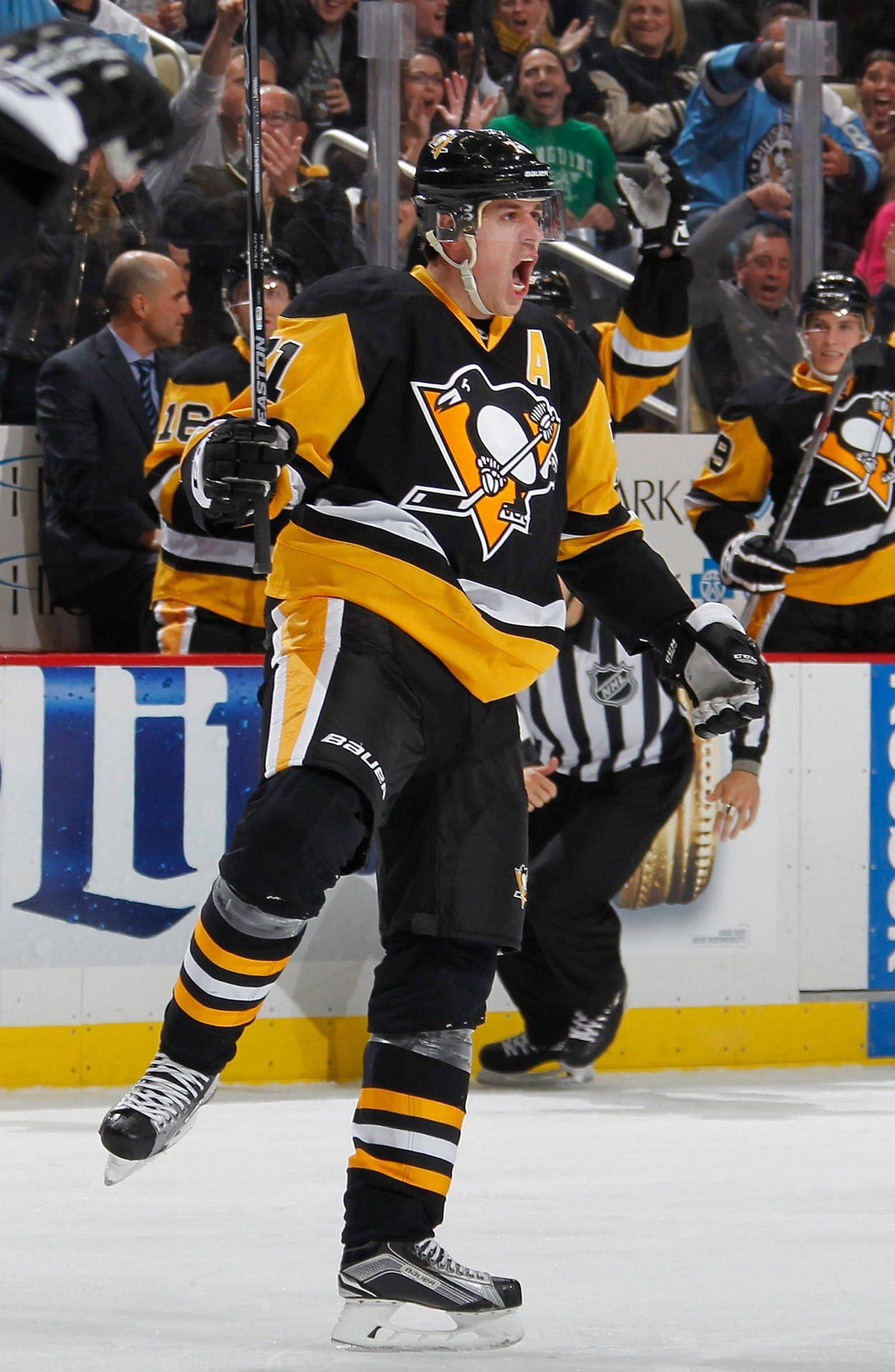 Evgeni Malkin Celebrating A Goal On Ice Background