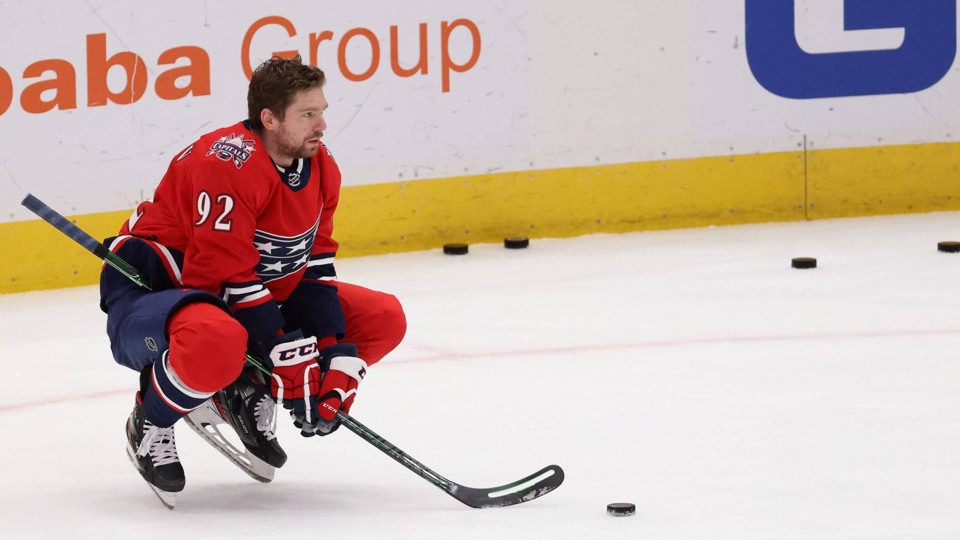 Evgeny Kuznetsov In Action On The Ice Background