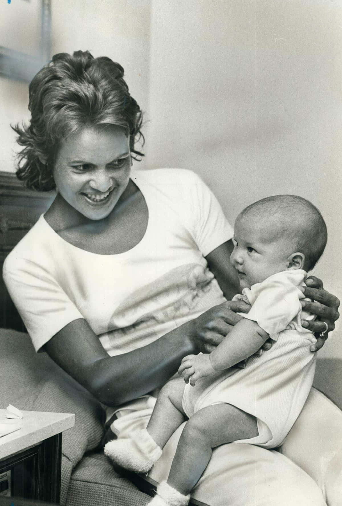 Evonne Goolagong Cawley Sharing A Moment With Her Daughter Background