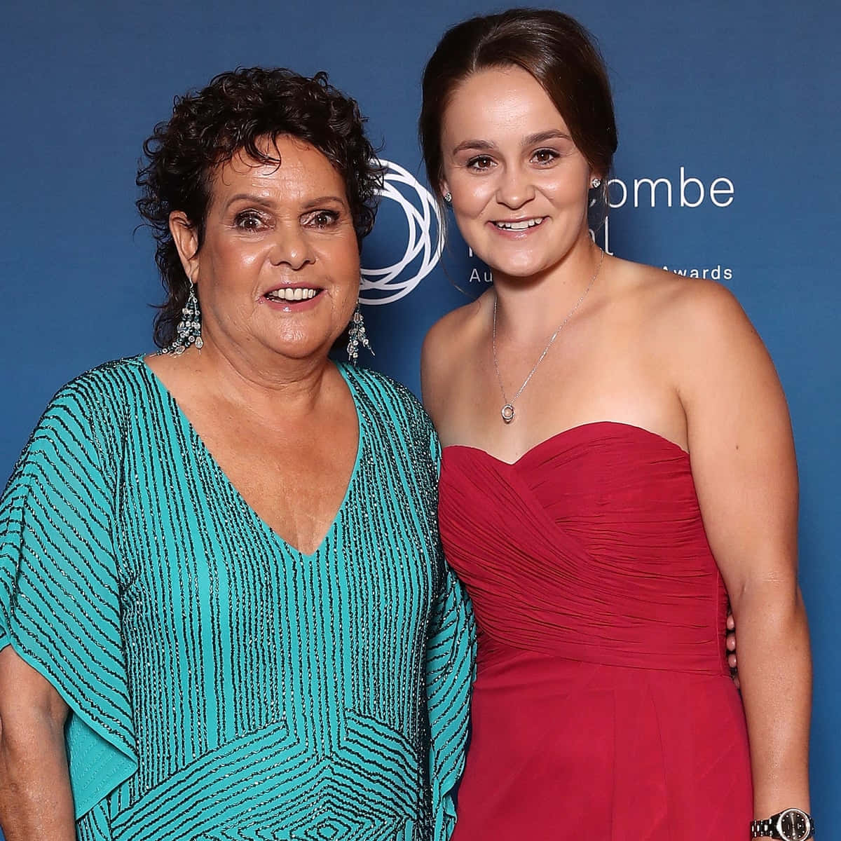 Evonne Goolagong Cawley With Ashleigh Barty On The Tennis Court Background