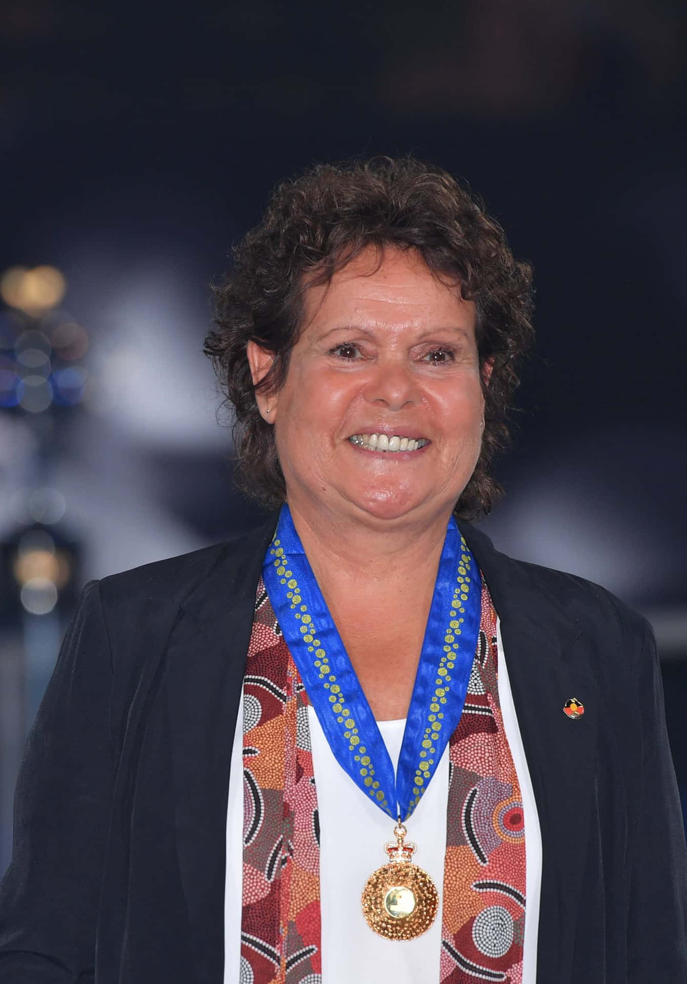 Evonne Goolagong Cawley With Medal Background