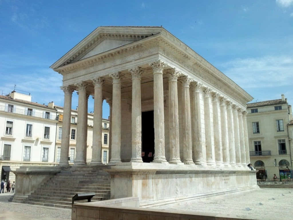 Exceptional View Of Maison Carrée On A Sunny Day Background