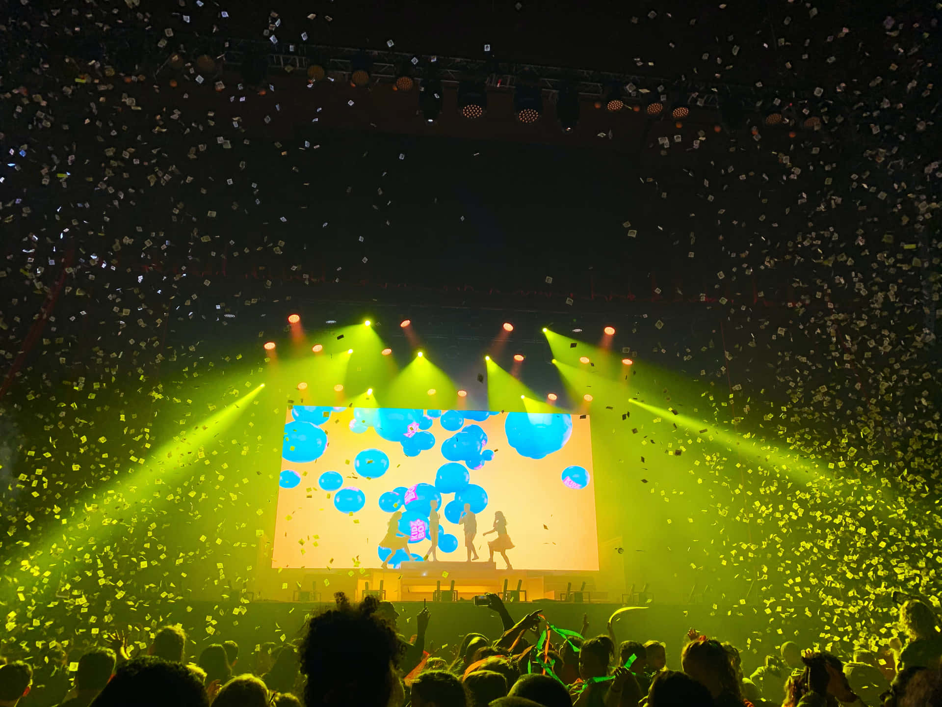 Excited Crowd At An Electrifying Music Festival Background