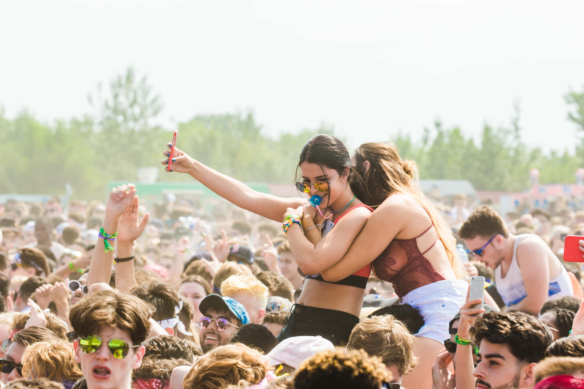 Excited Crowds Enjoying A Vibrant Music Festival