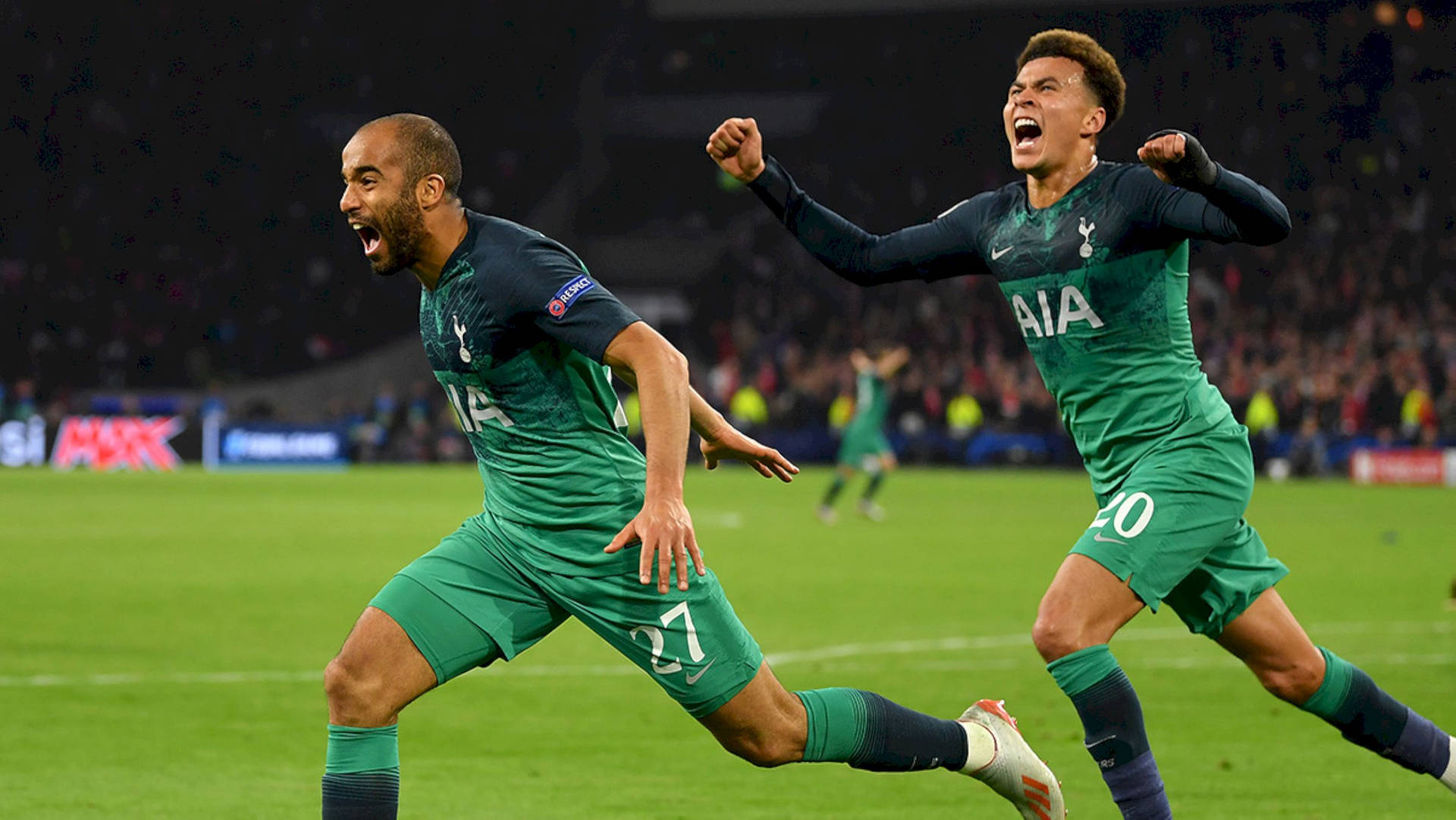 Excited Lucas Moura Running With Teammate Background