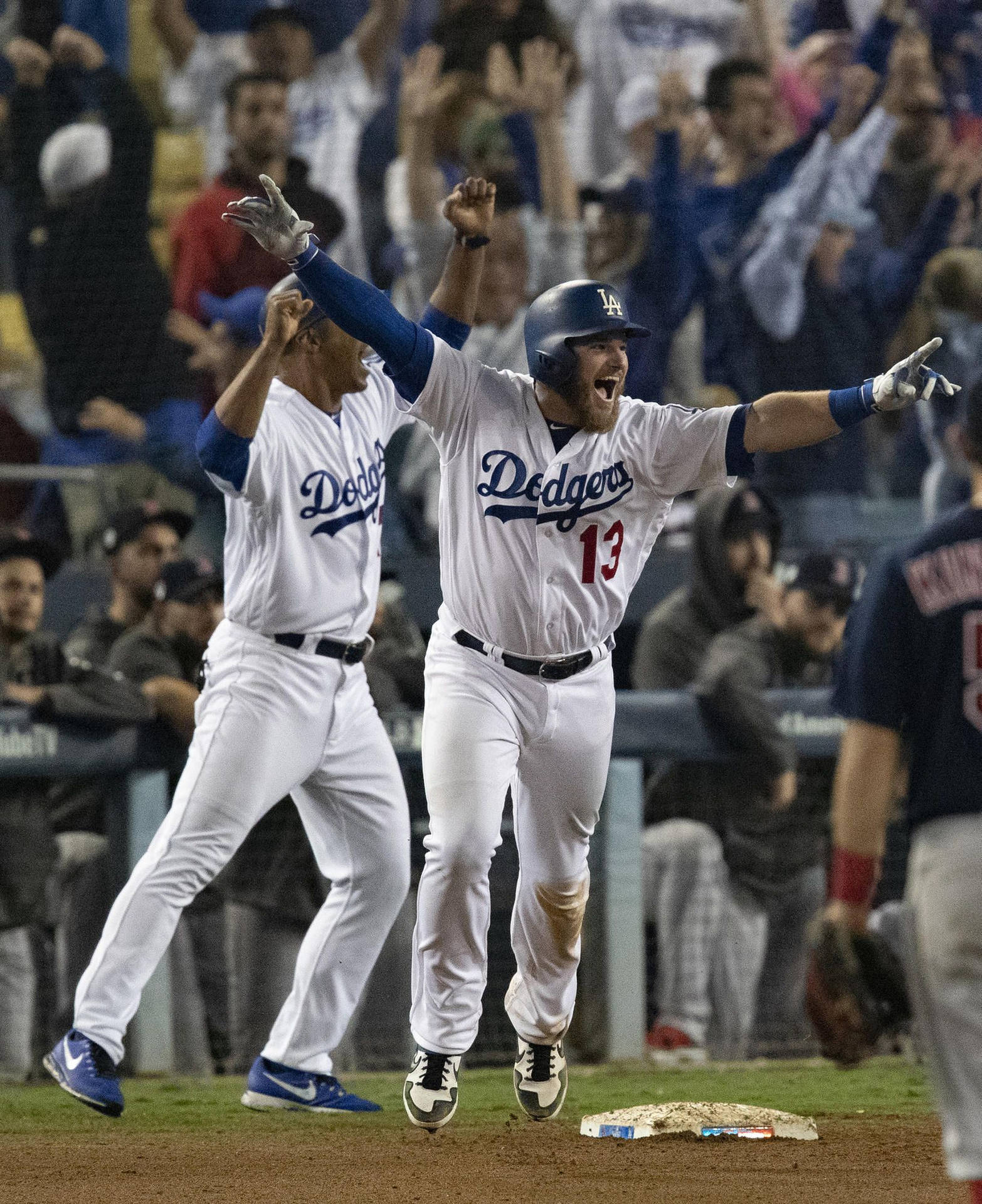 Excited Max Muncy With Teammate Background