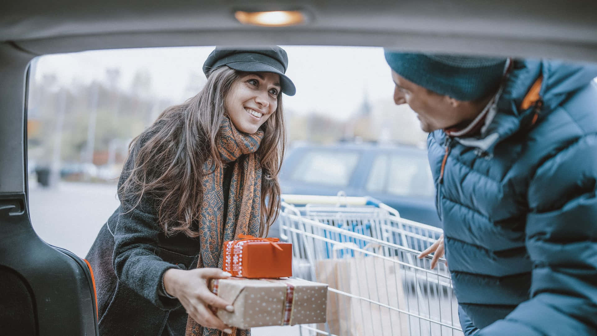 Excited Shopper Carrying Boxes During Boxing Day Sale Background