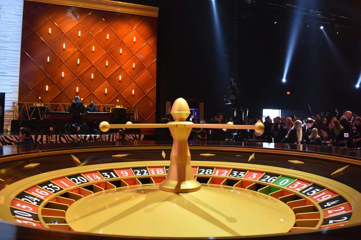 Exciting Moments At The Roulette Table Background