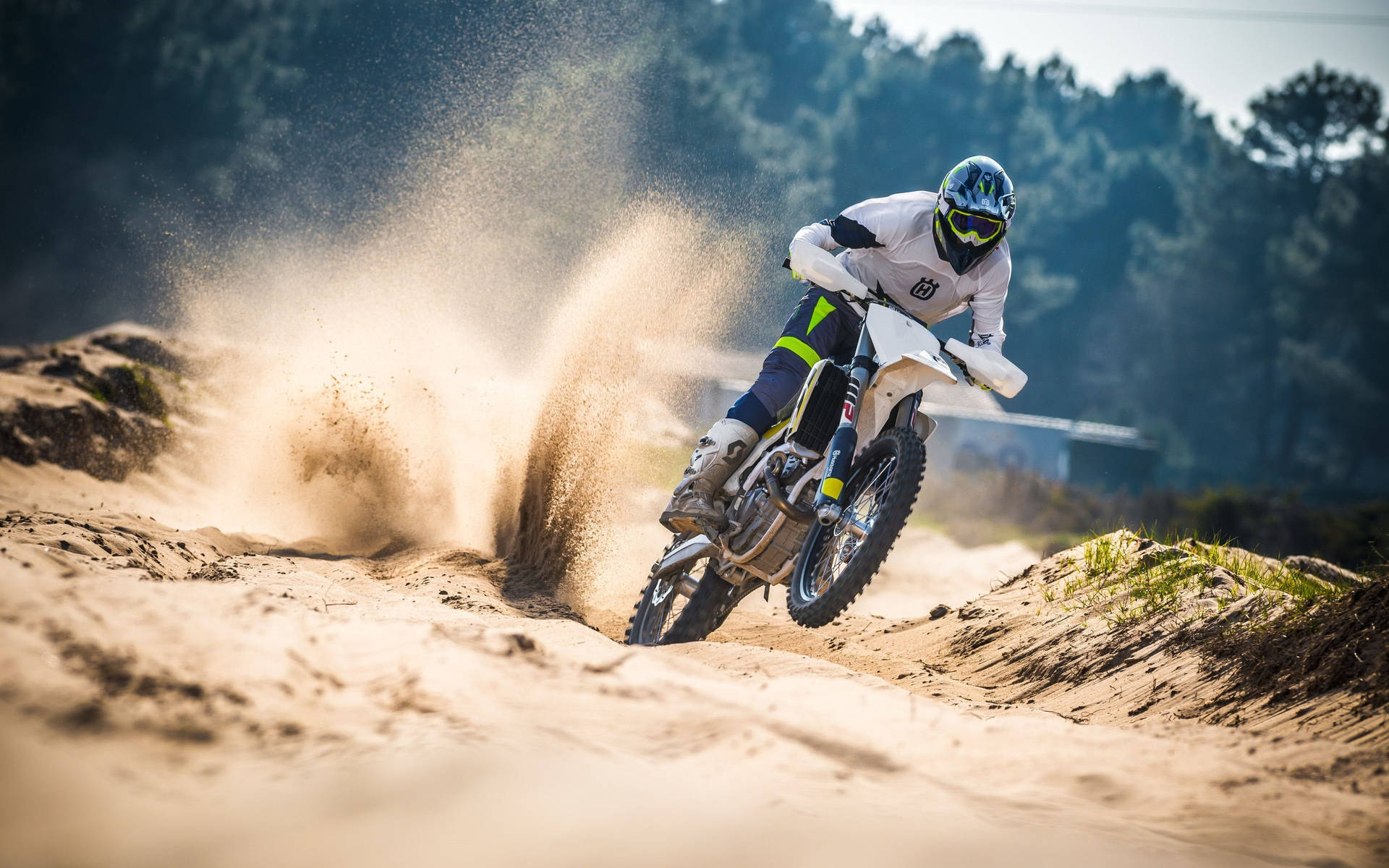 Exciting Motocross Racing In Action Background