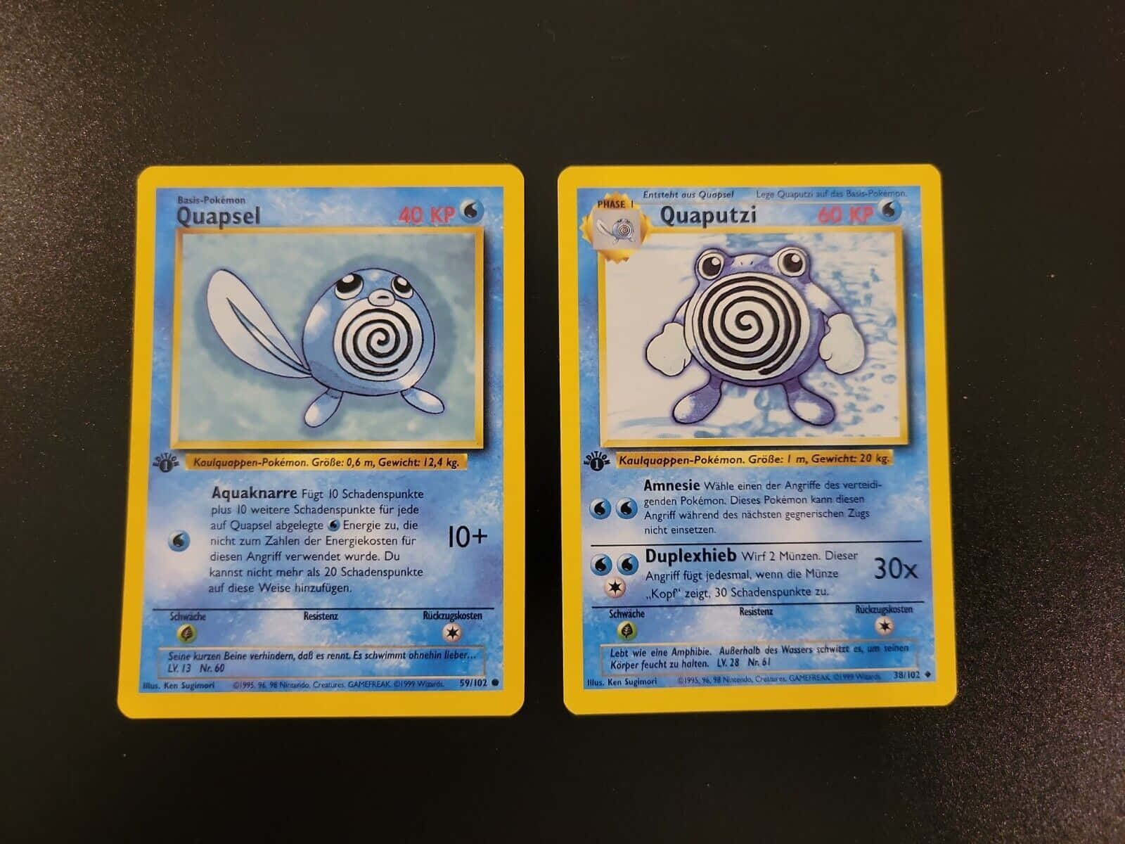 Exciting Pokemon - Poliwag Battle With Poliwhirl In A Game Card Background