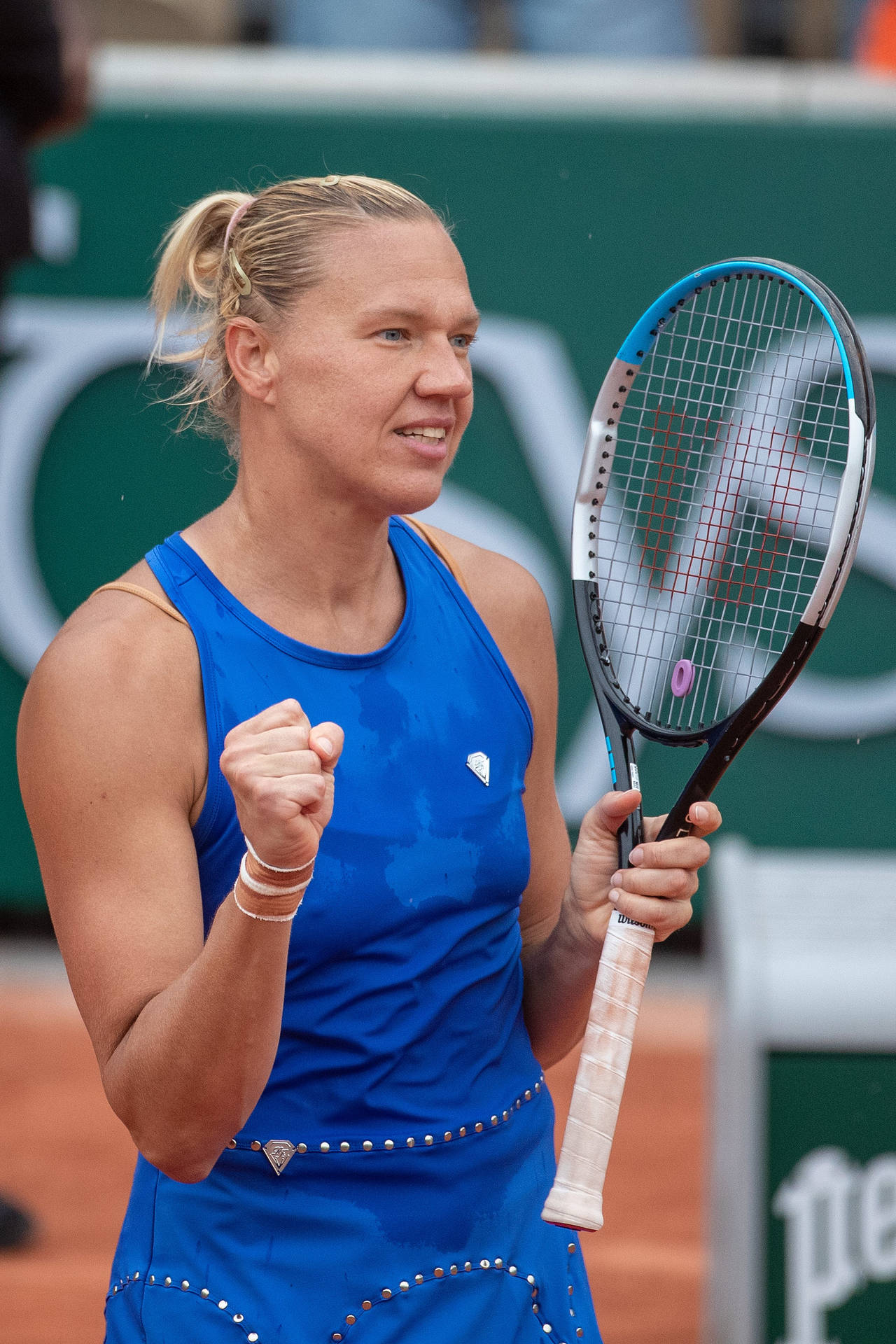 Exhilarating Victory Moment Of Kaia Kanepi In A Tennis Match Background