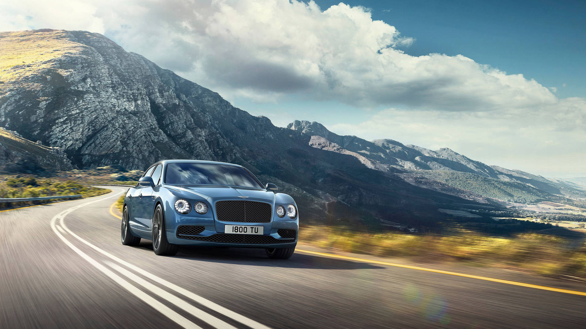 Experience Luxury And Performance With The Bentley Flying Spur Background