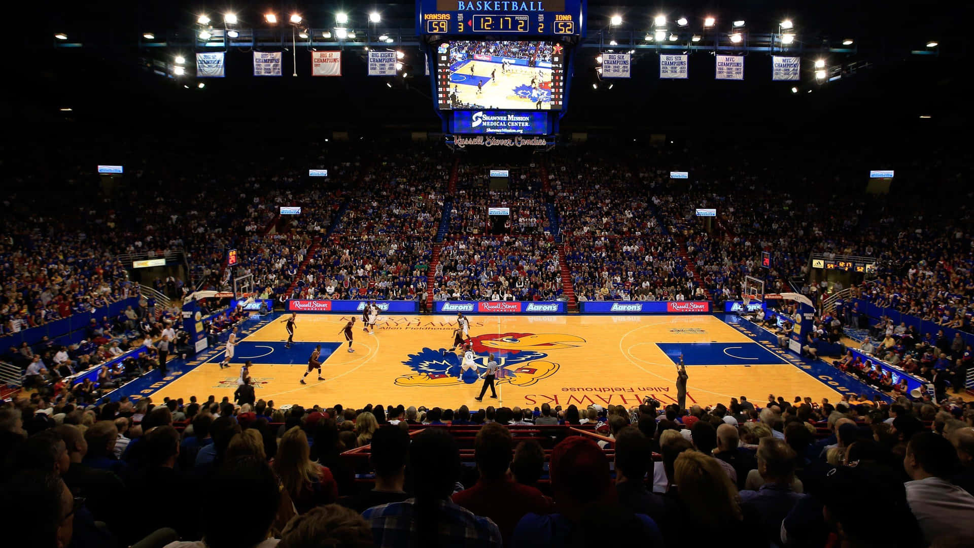 Experience Pure Jayhawk Excitement As The University Of Kansas Takes On Their Opponents! Background