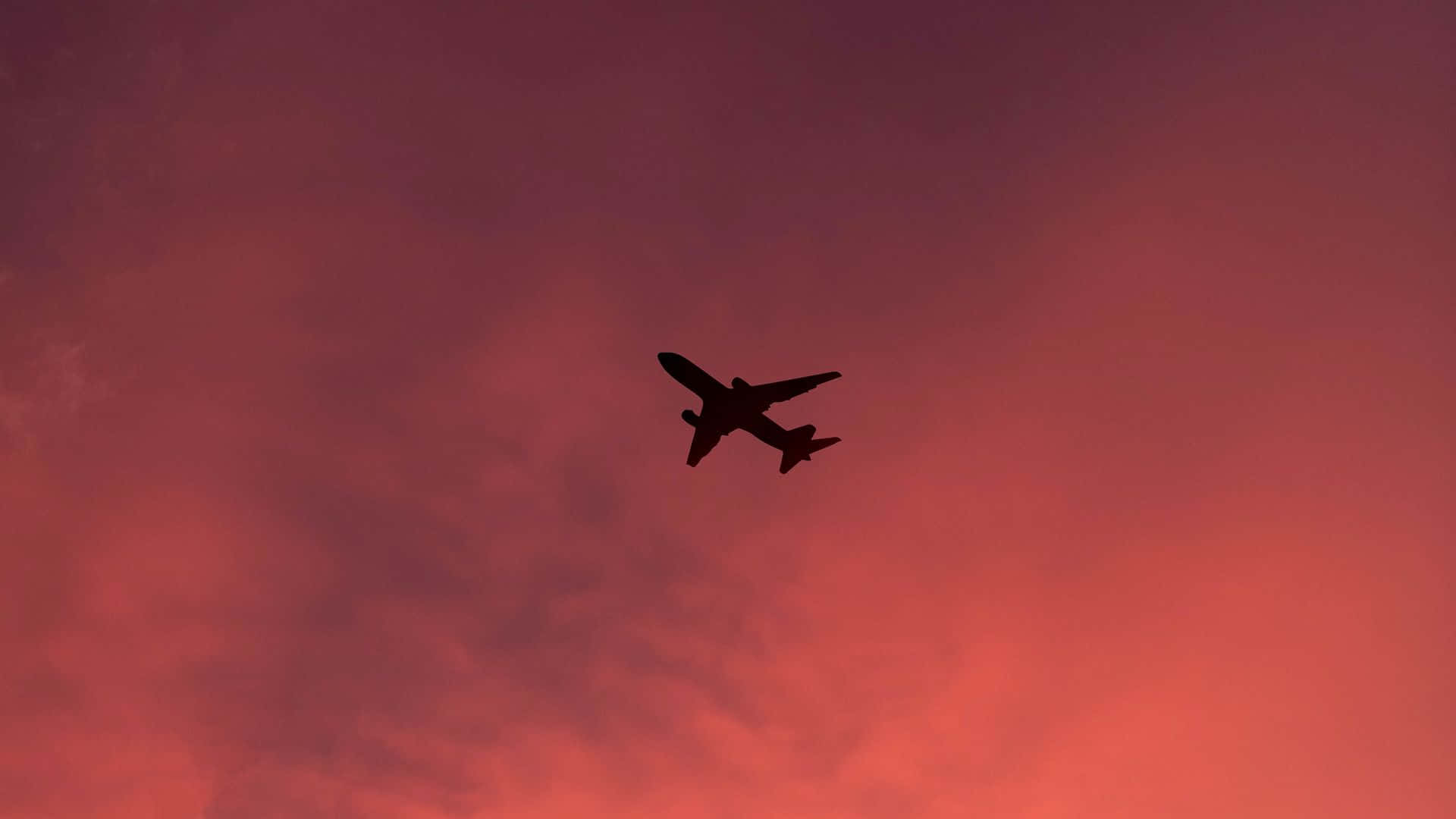 Experience The Beauty Of Flight In A Gorgeous Pink Plane Background