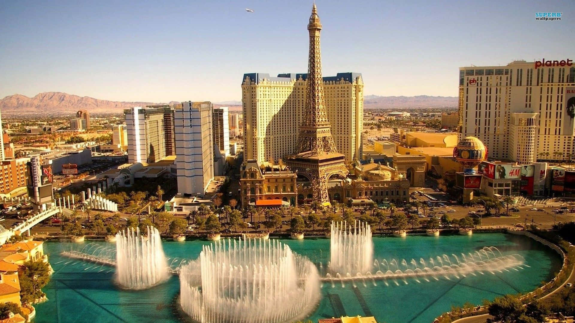 Experience The Buzzing Energy Of Las Vegas As Its Skyline Lights Up In The Night.