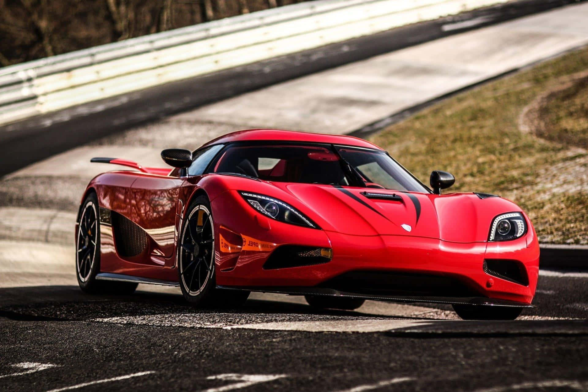 Experience The Power Of A Koenigsegg In Motion Background