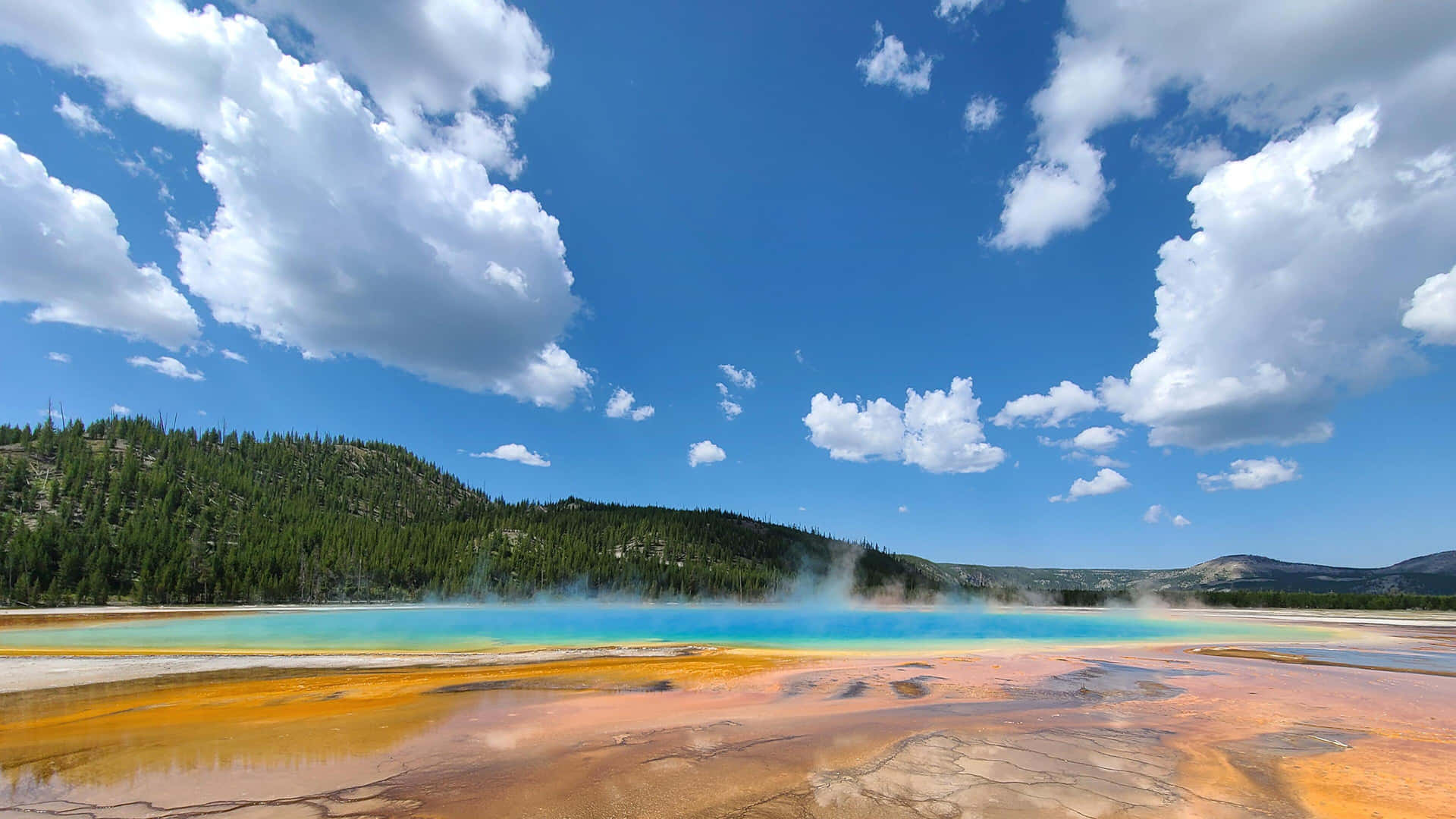 Experience The Power Of Old Faithful Geyser In Yellowstone National Park Background