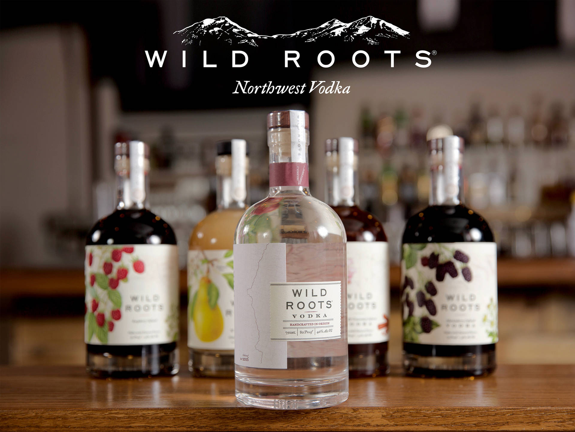 Experience The Pure Taste Of The Northwest With Wild Roots Vodka Background