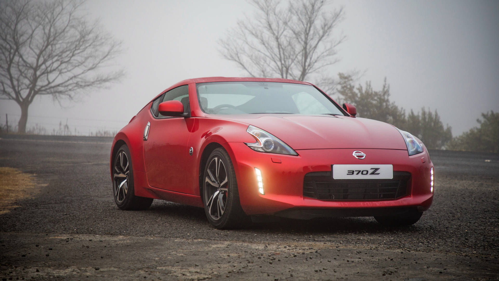 Experience The Sharp Design And Powerful Performance Of The Nissan 370z Background