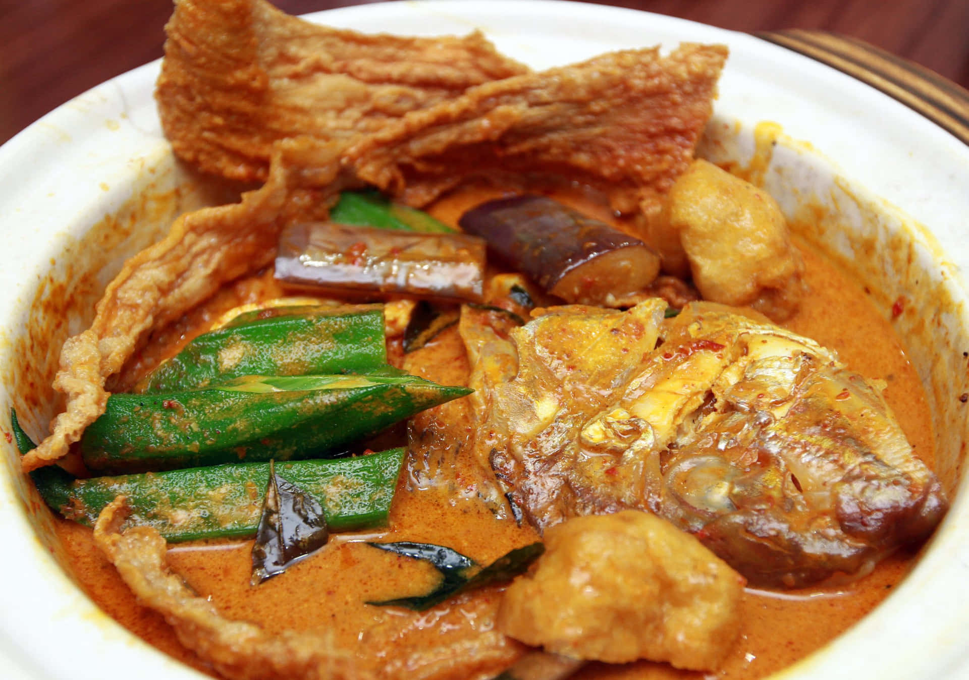 Experience The Taste Of Exquisite Red Snapper Fish Head Curry Background