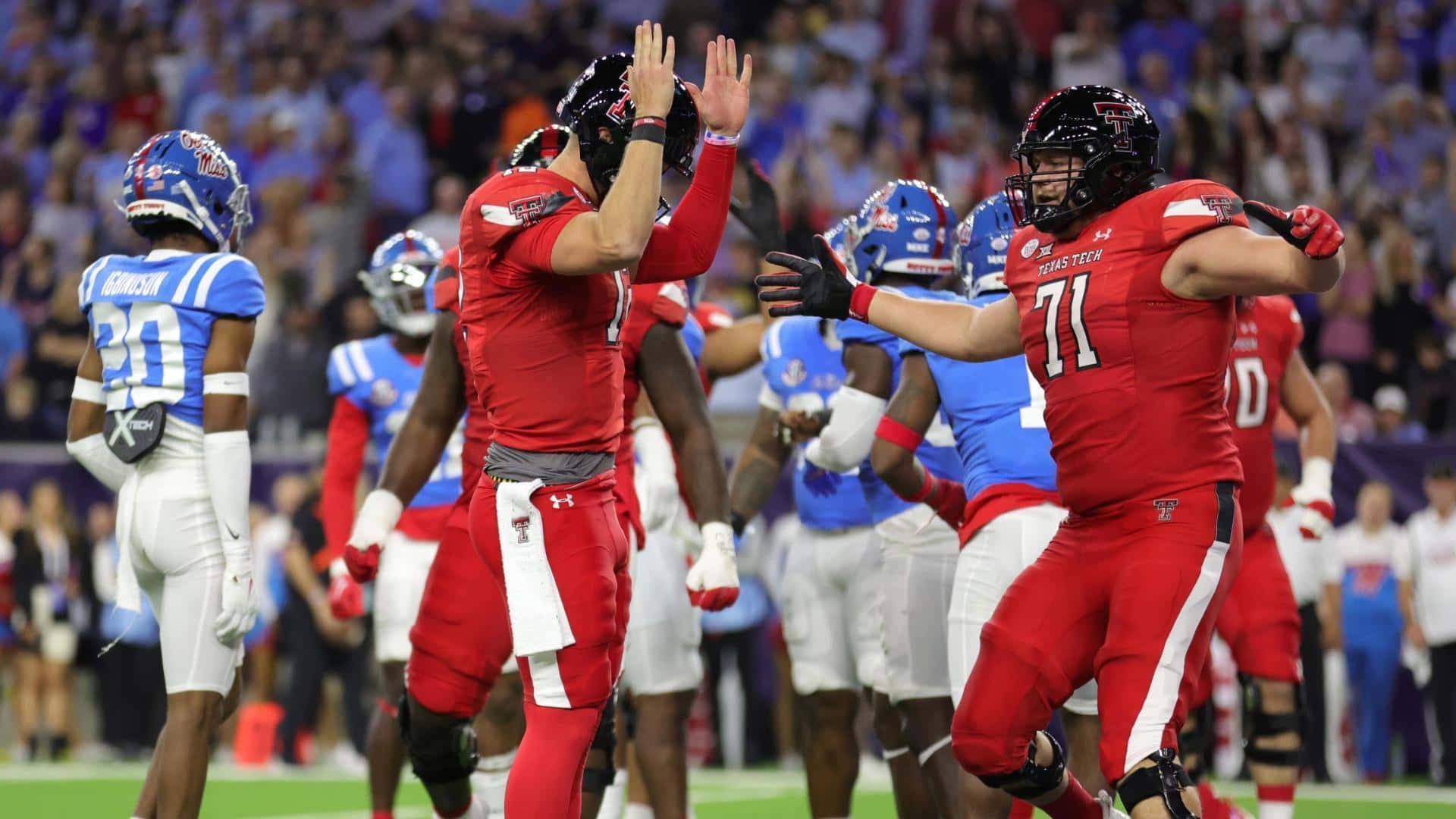 Experience The Thrill Of The Game On The Texas Tech University Campus. Background