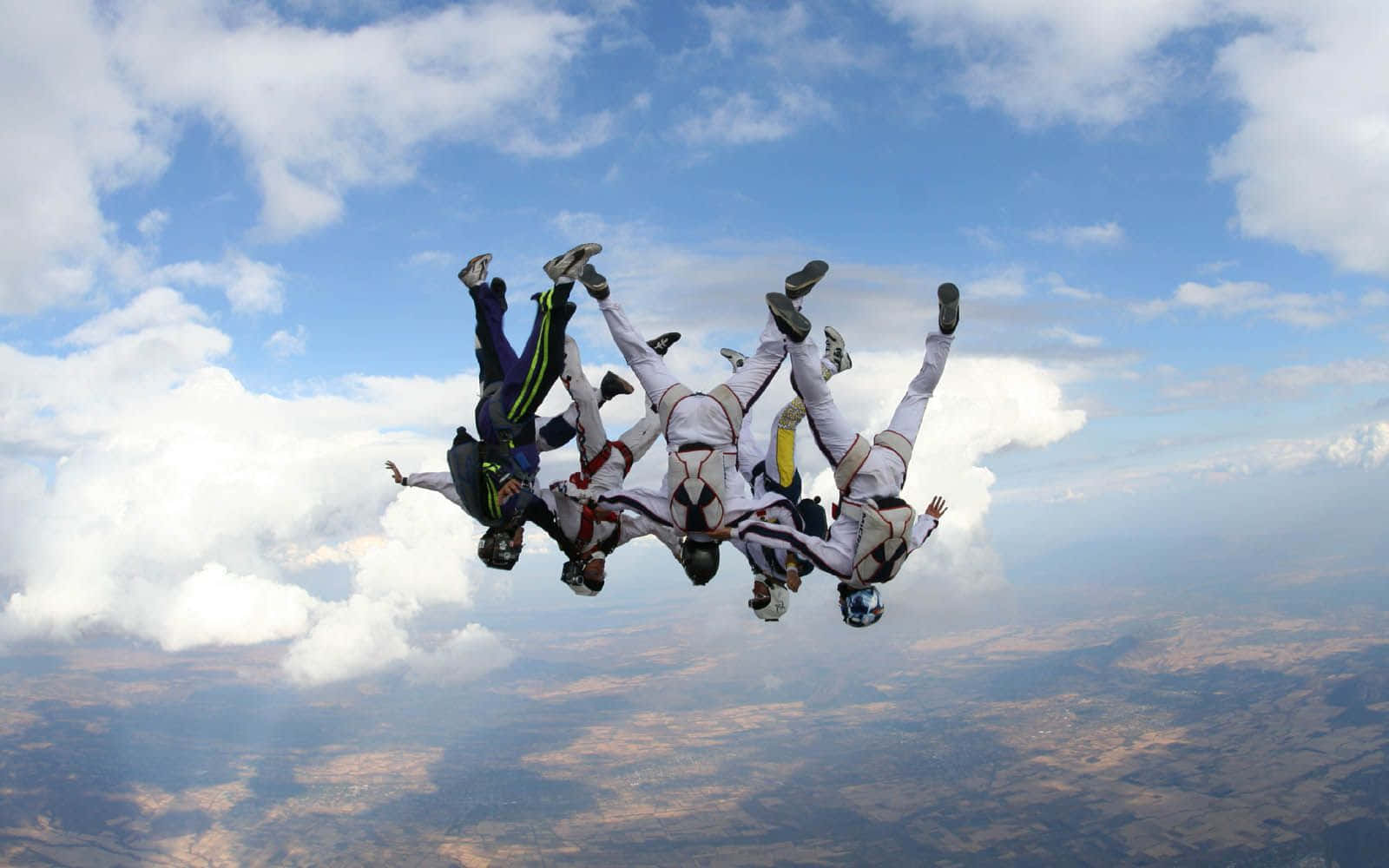 Experience The Thrill - Skydiving Upside Down Background