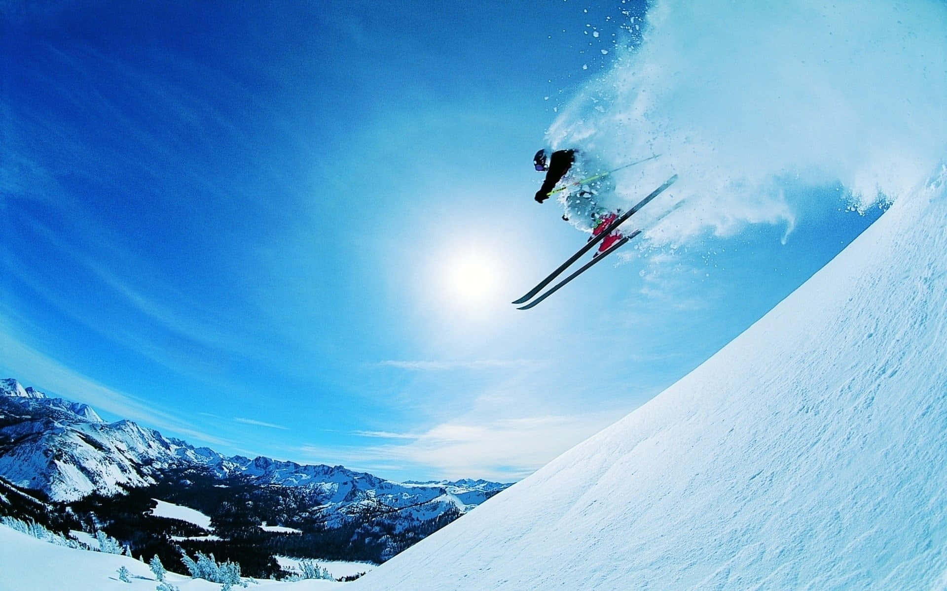 Experience Thrilling Ski Slopes With Amazing Mountain Views Background