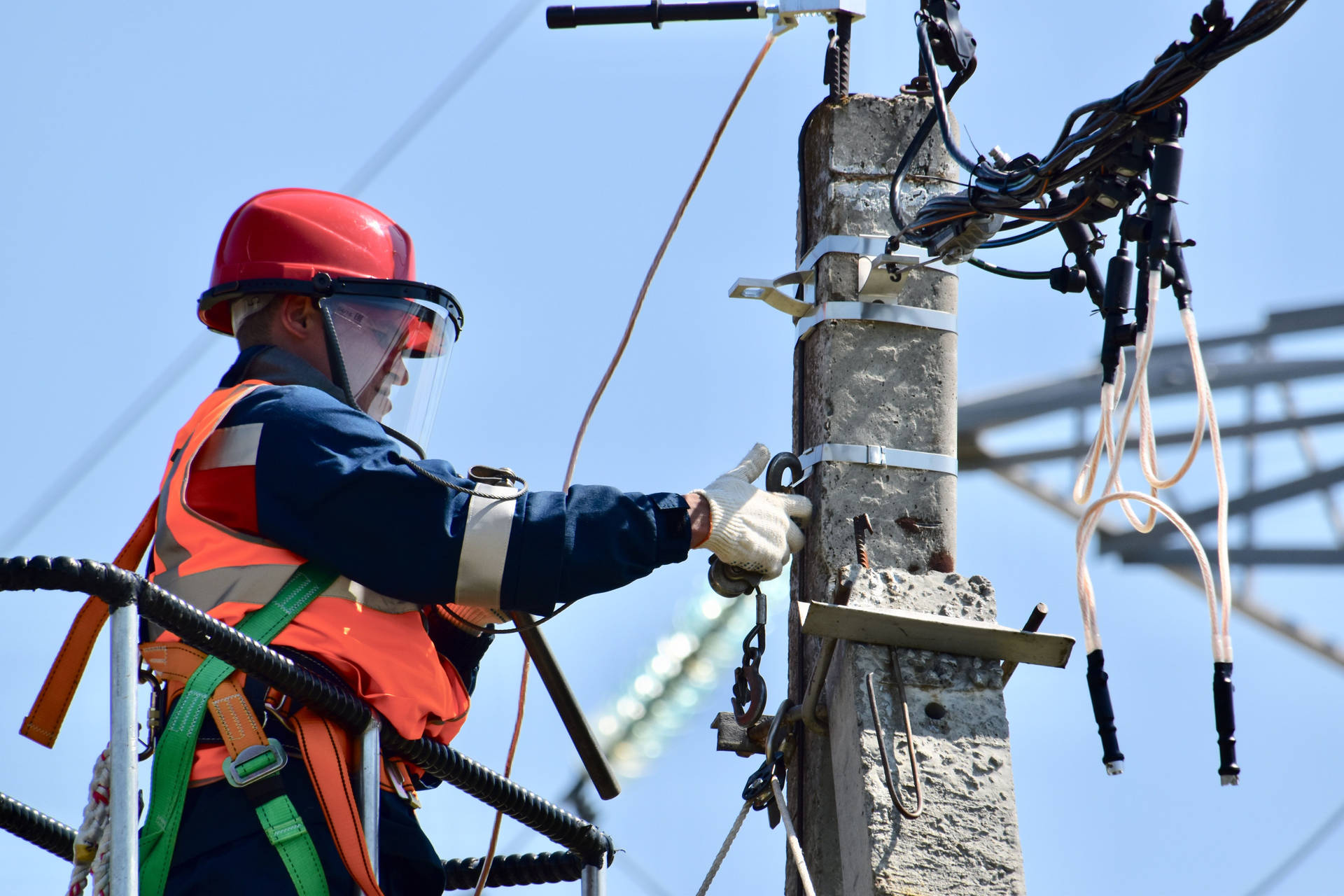 Experienced Electrician Repairing A Power Line