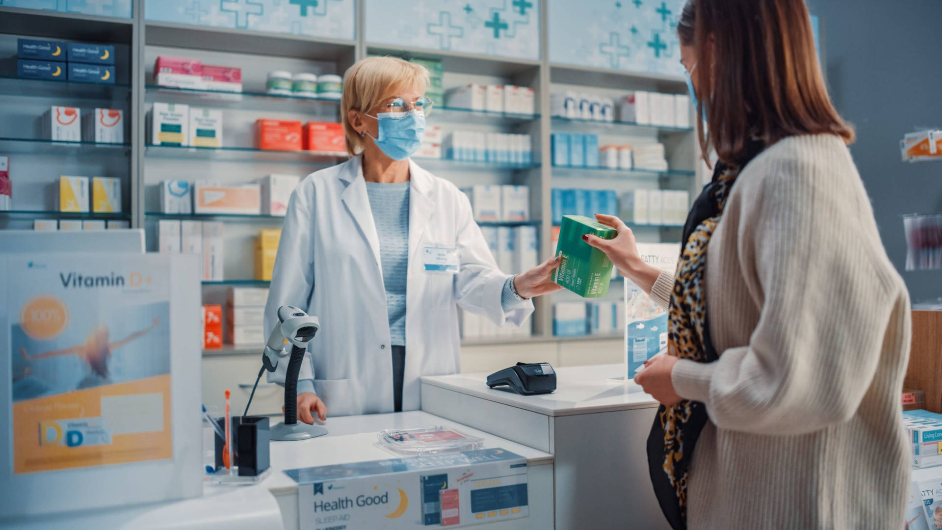 Experienced Female Pharmacist Assisting A Customer Background
