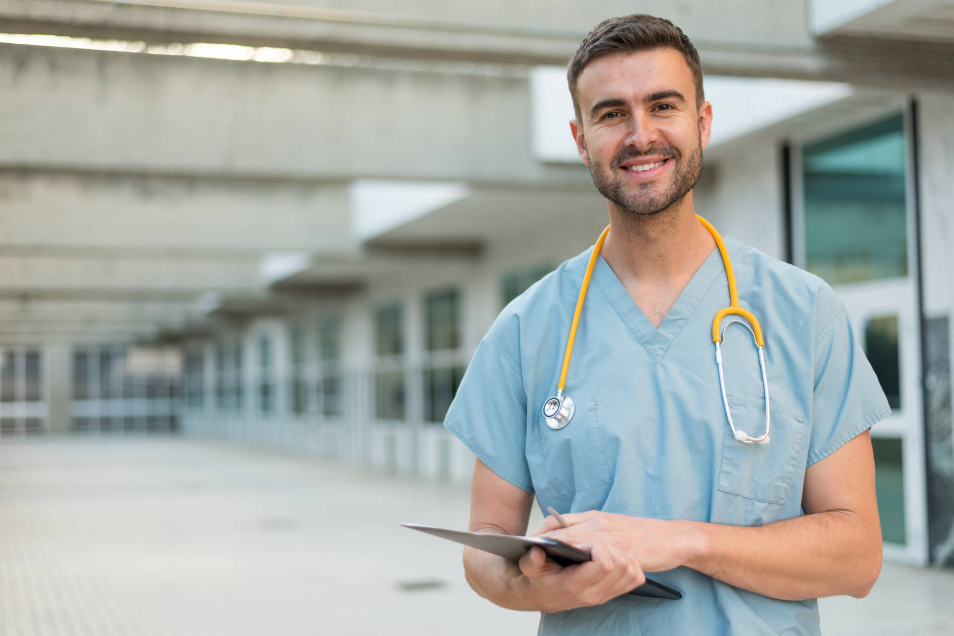 Experienced Male Nurse In Medical Uniform Background