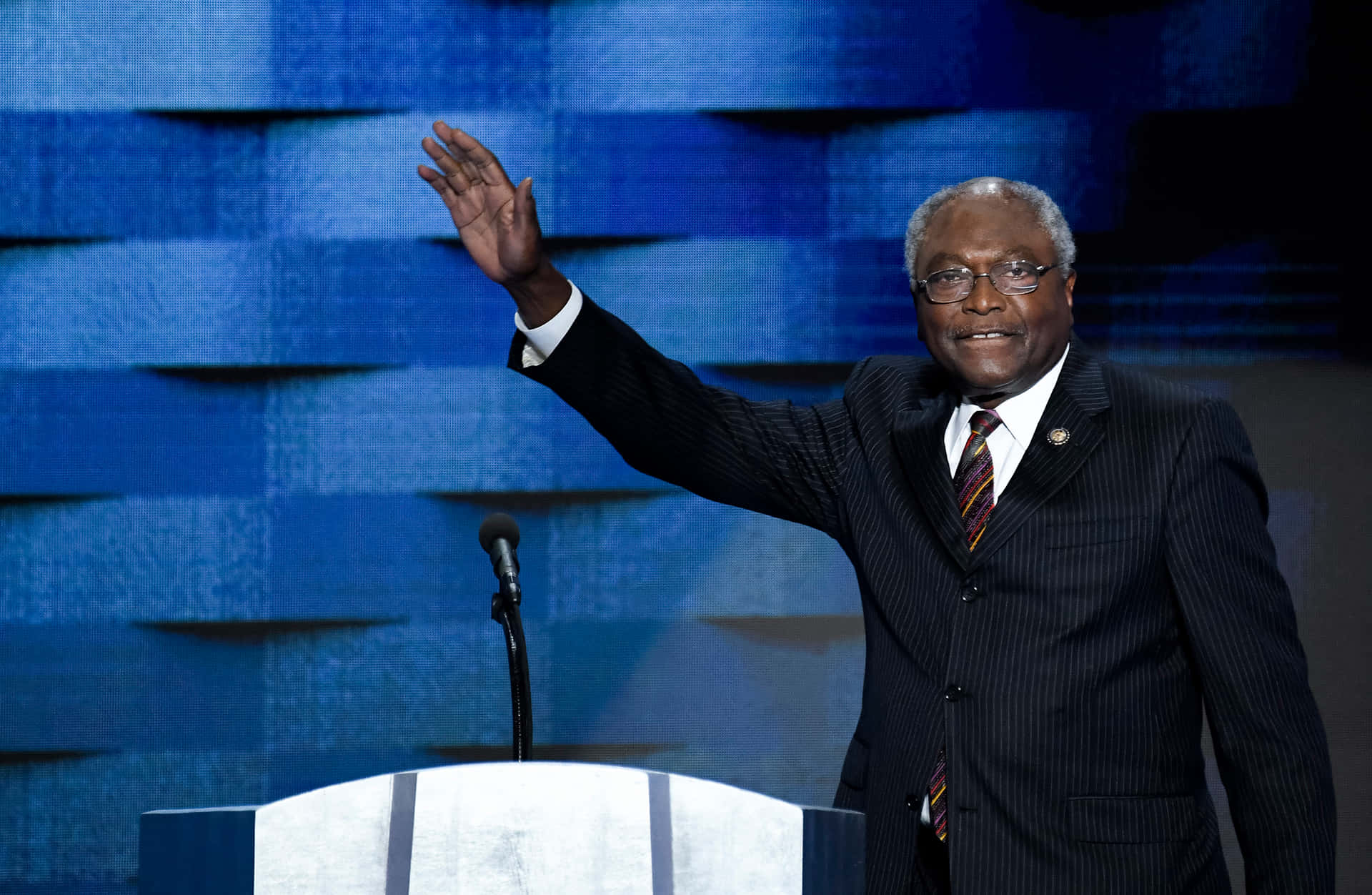 Experienced Politician Jim Clyburn Greeting With A Wave Background