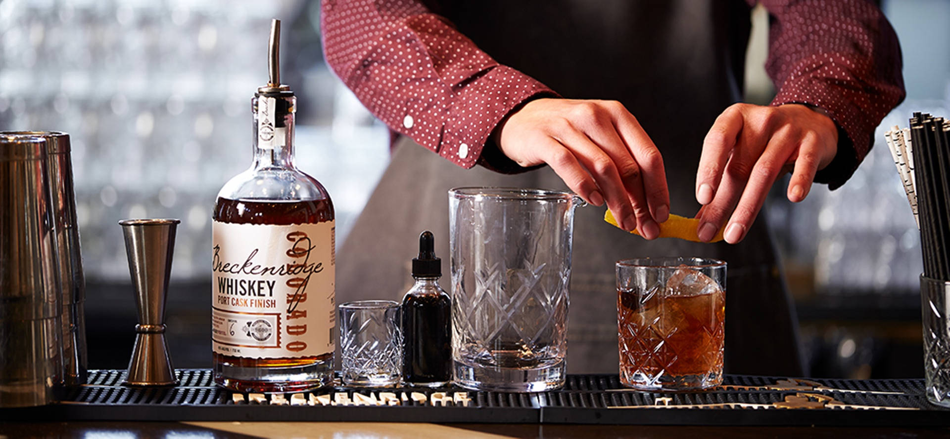 Expert Bartender Mixing A Signature Whiskey Cocktail At Breckenridge Distillery